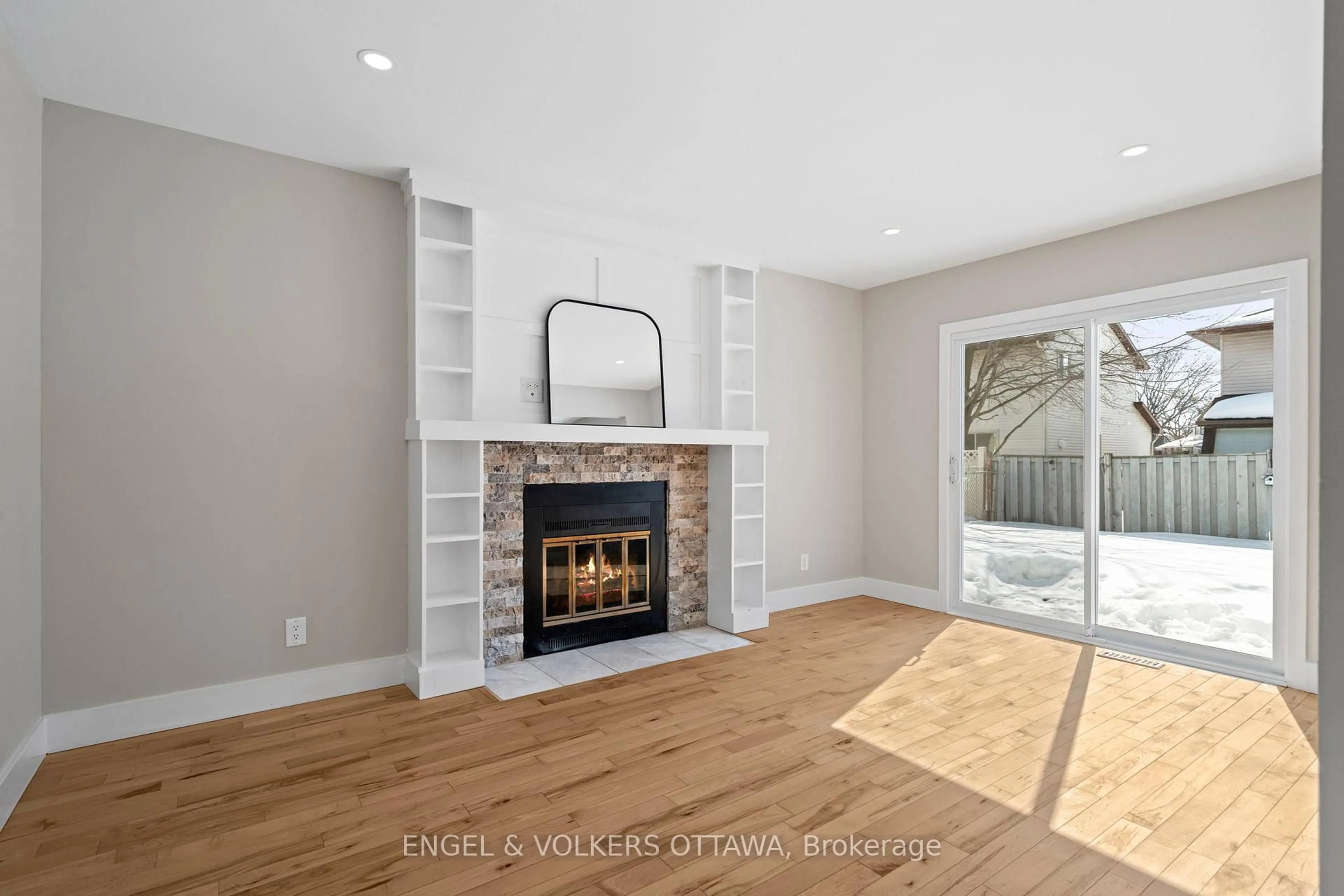 Living room with furniture, wood/laminate floor for 6346 Beausejour Dr, Ottawa Ontario K1C 3J8