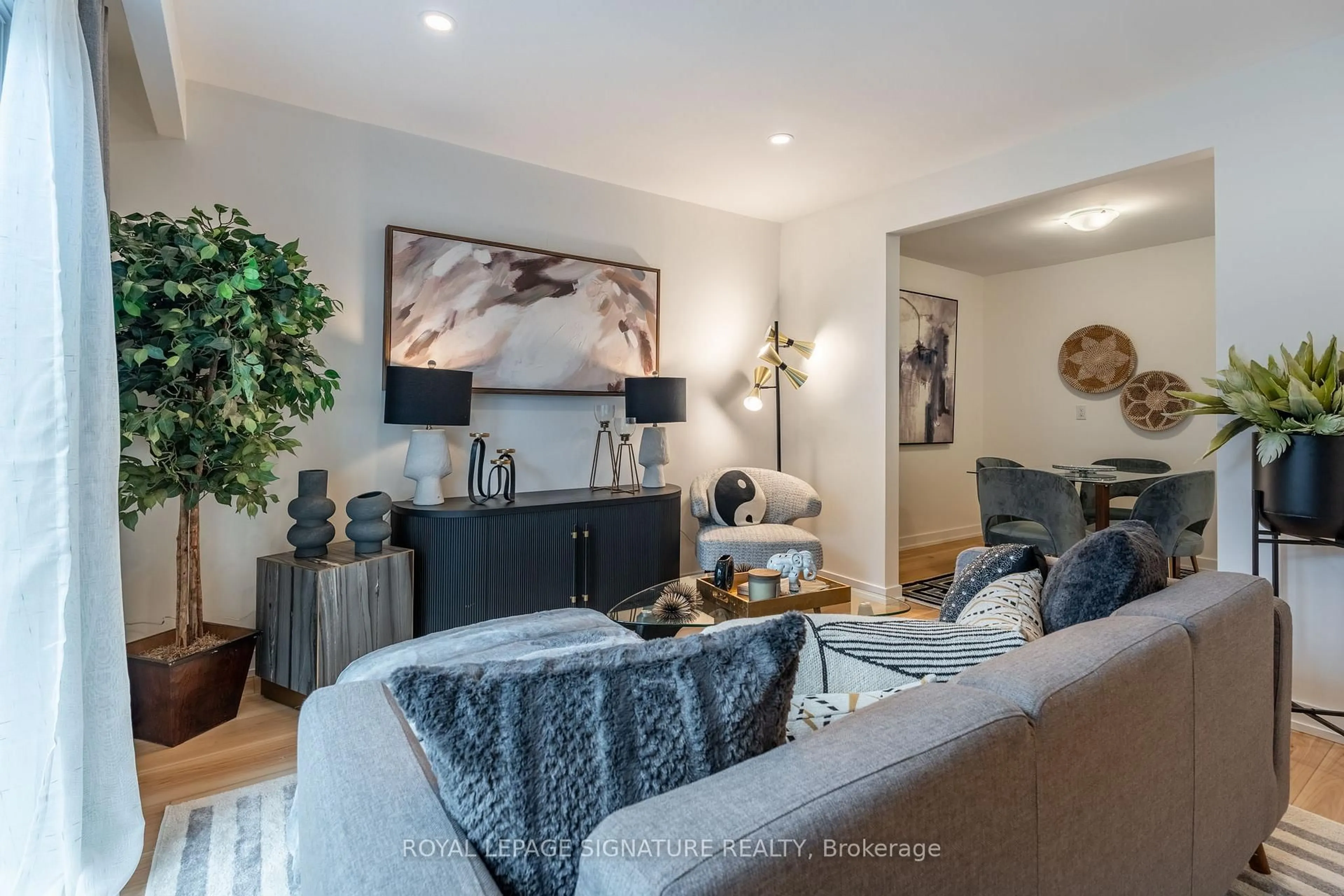 Living room with furniture, wood/laminate floor for 22 Woodman Dr, Hamilton Ontario L8H 2M5