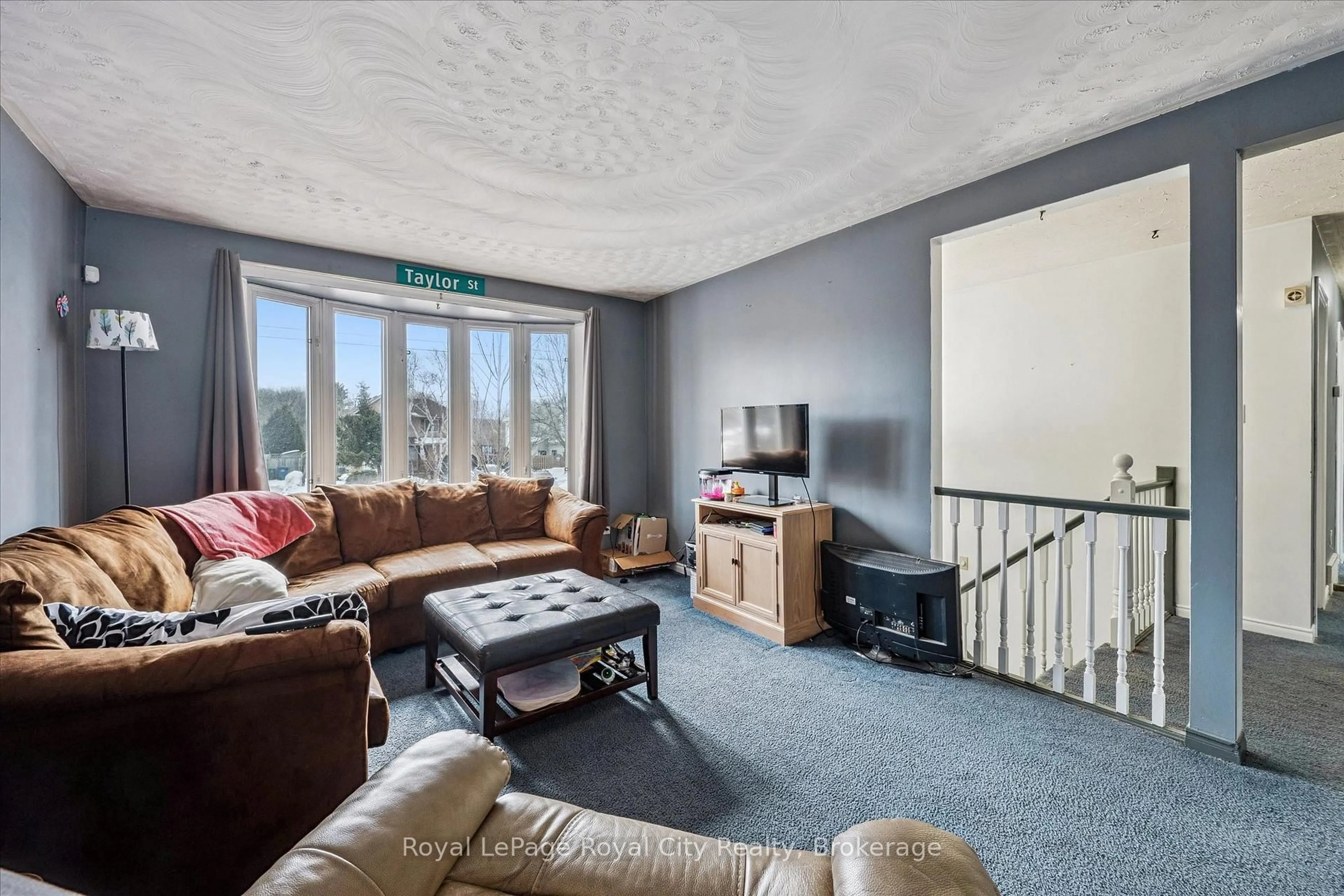 Living room with furniture, carpet floor for 668 Edinburgh Rd, Guelph Ontario N1G 4H8