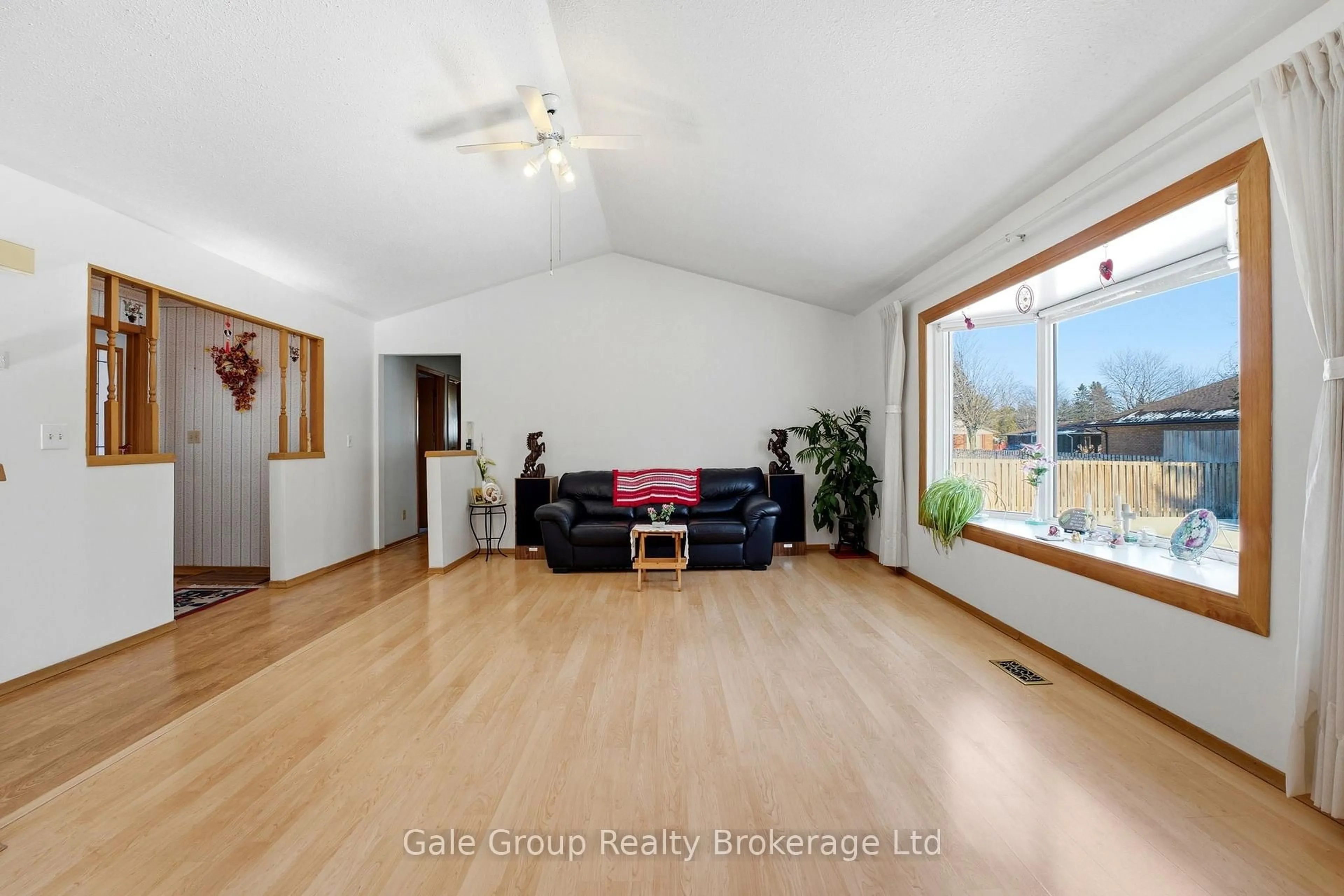 Living room with furniture, wood/laminate floor for 38 Adams Ave, Tillsonburg Ontario N4G 5B3