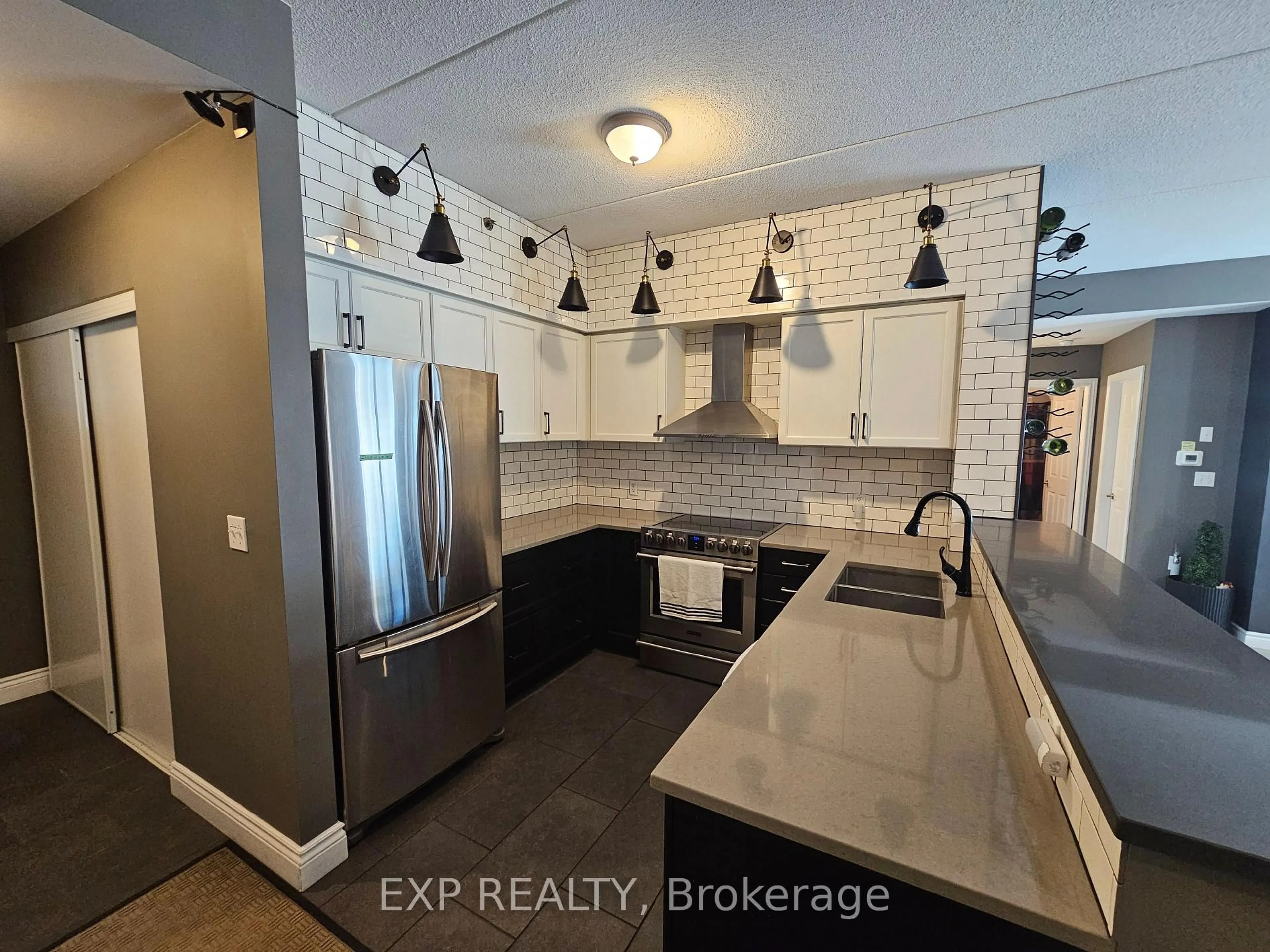 Open concept kitchen, ceramic/tile floor for 308 Watson Pkwy #102, Guelph Ontario N1E 0G7