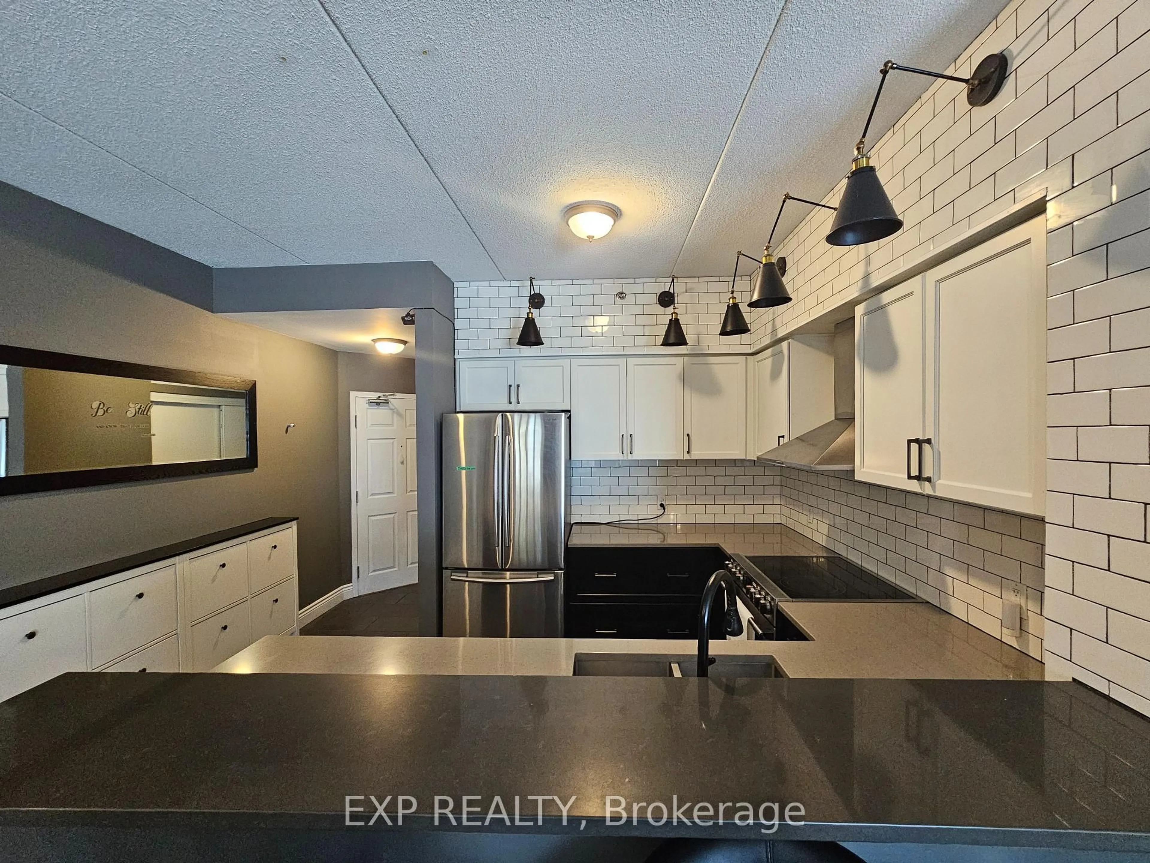 Open concept kitchen, ceramic/tile floor for 308 Watson Pkwy #102, Guelph Ontario N1E 0G7