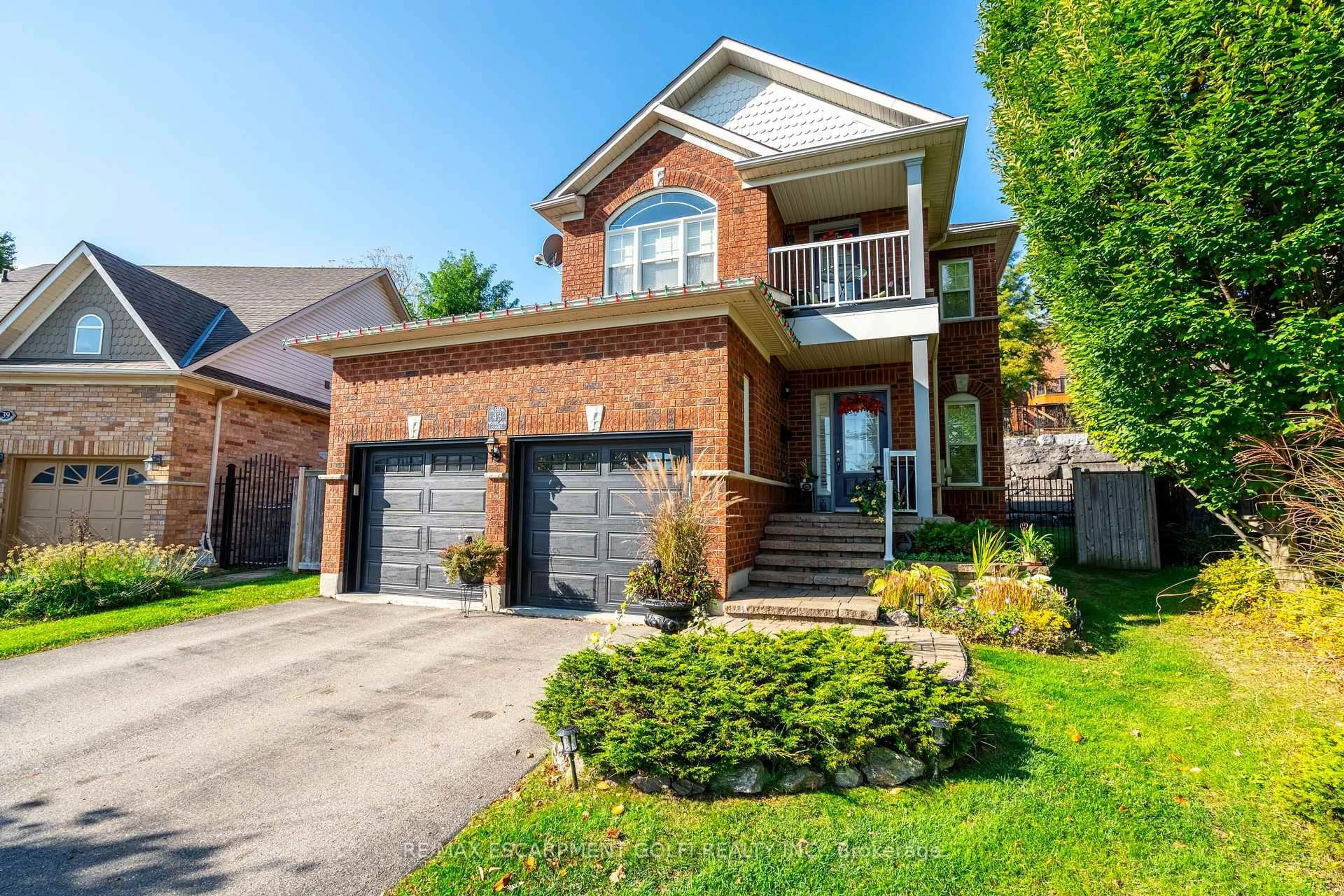 Home with brick exterior material, street for 43 Woodlawn Crt, Hamilton Ontario L9H 7S2