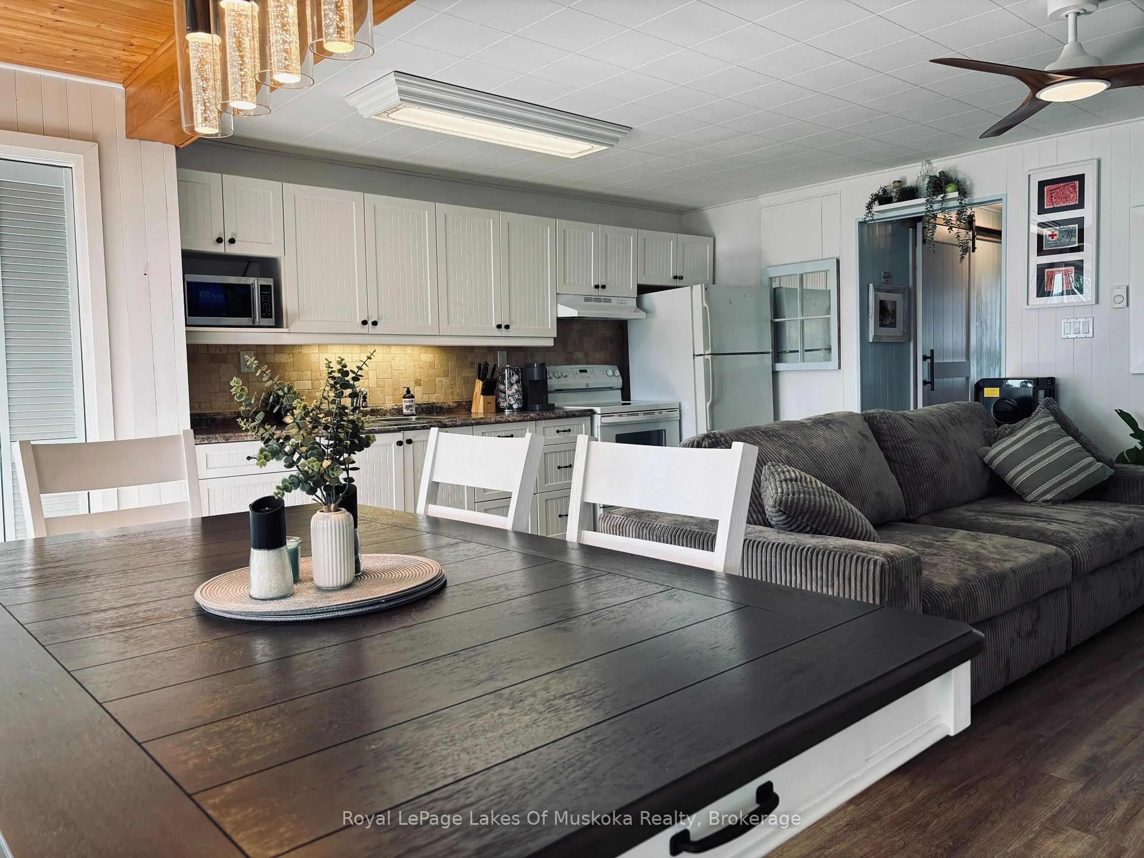 Open concept kitchen, wood/laminate floor for 1115 Kahshe Lake Rd #5, Gravenhurst Ontario P0E 1G0