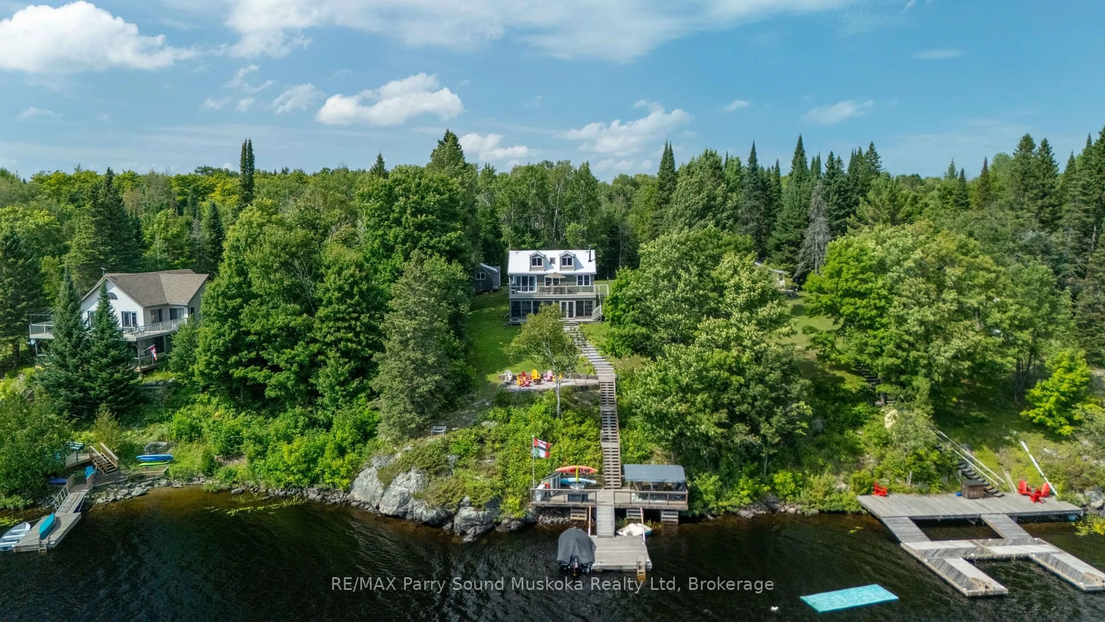 A pic from outside/outdoor area/front of a property/back of a property/a pic from drone, water/lake/river/ocean view for 16 Golden Horseshoe Lane, Whitestone Ontario P0G 1G0