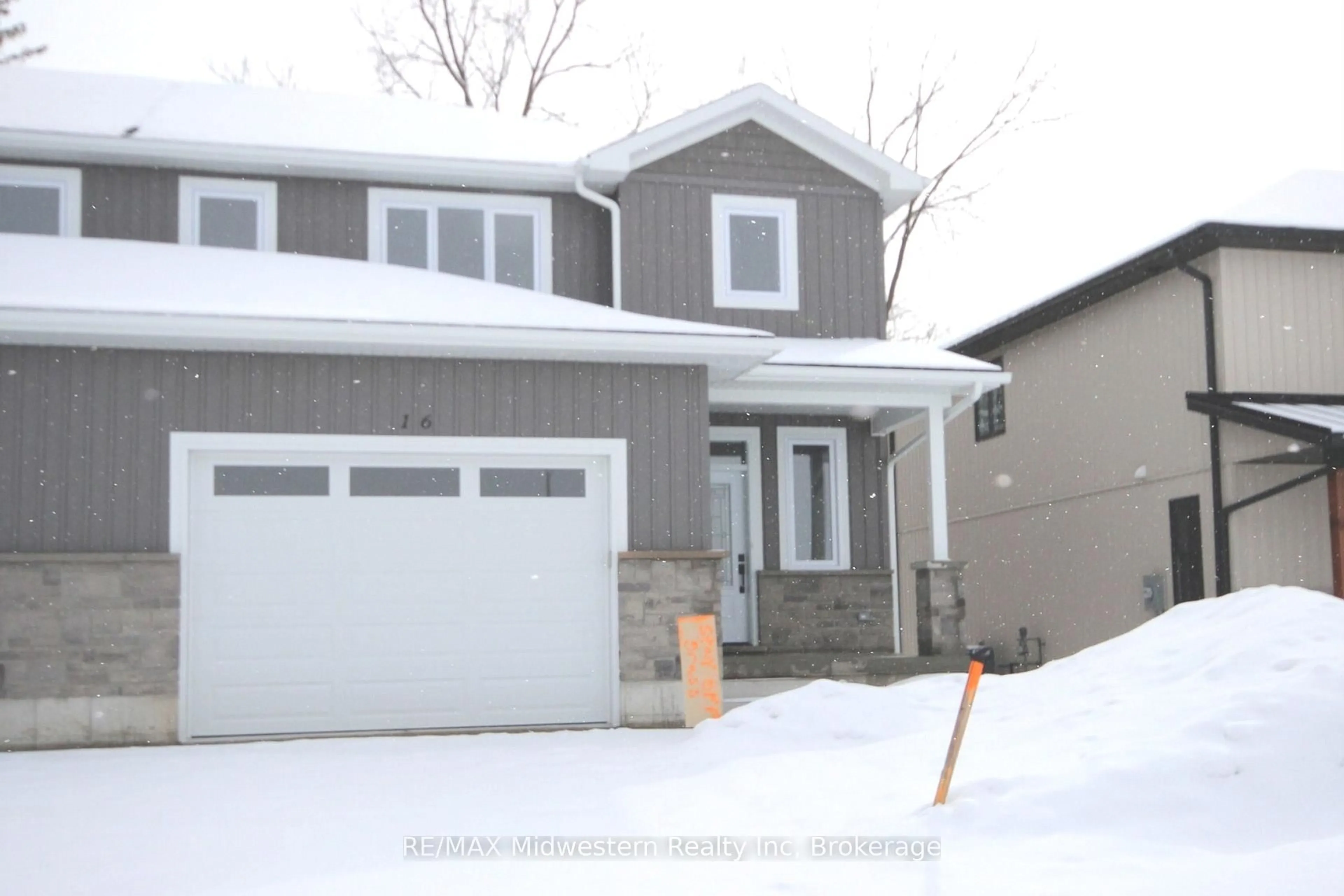 Home with vinyl exterior material, street for 16 Roberts St, Huron East Ontario N0G 1B0