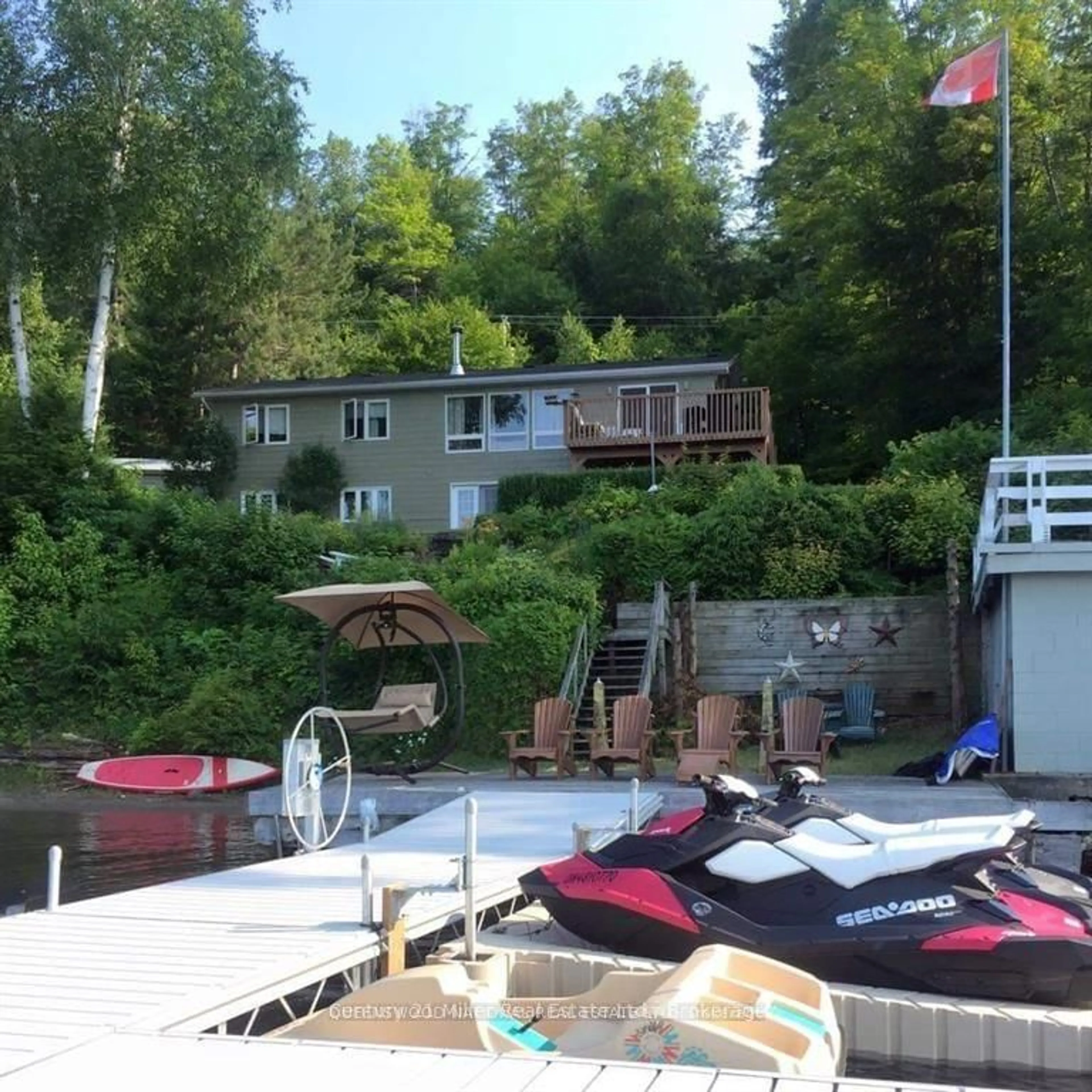 A pic from outside/outdoor area/front of a property/back of a property/a pic from drone, water/lake/river/ocean view for 994 Kamaniskeg Lake Rd, Combermere Ontario K0J 1L0