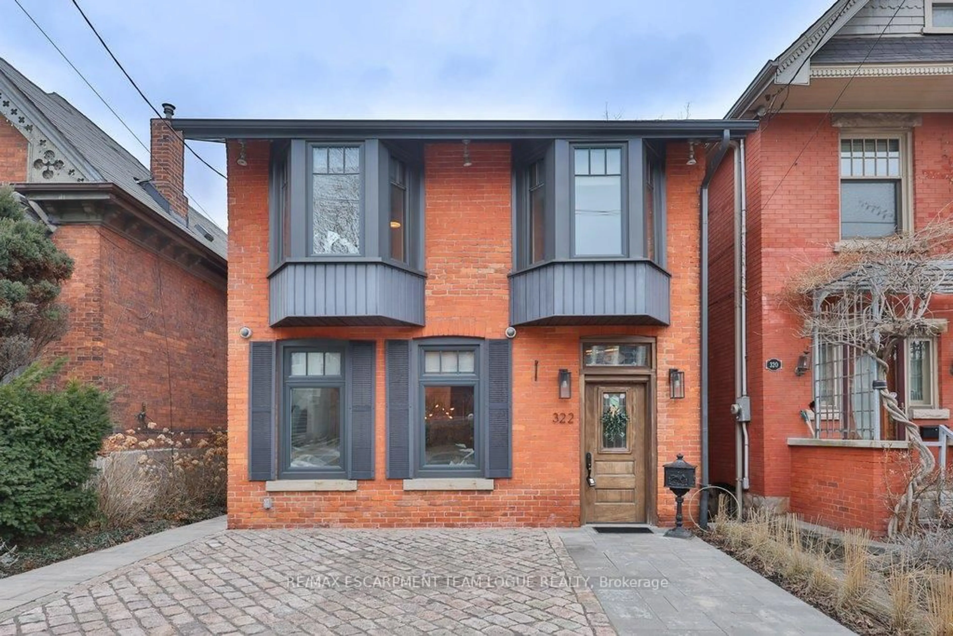 Home with brick exterior material, street for 322 CAROLINE St, Hamilton Ontario L8P 3M1