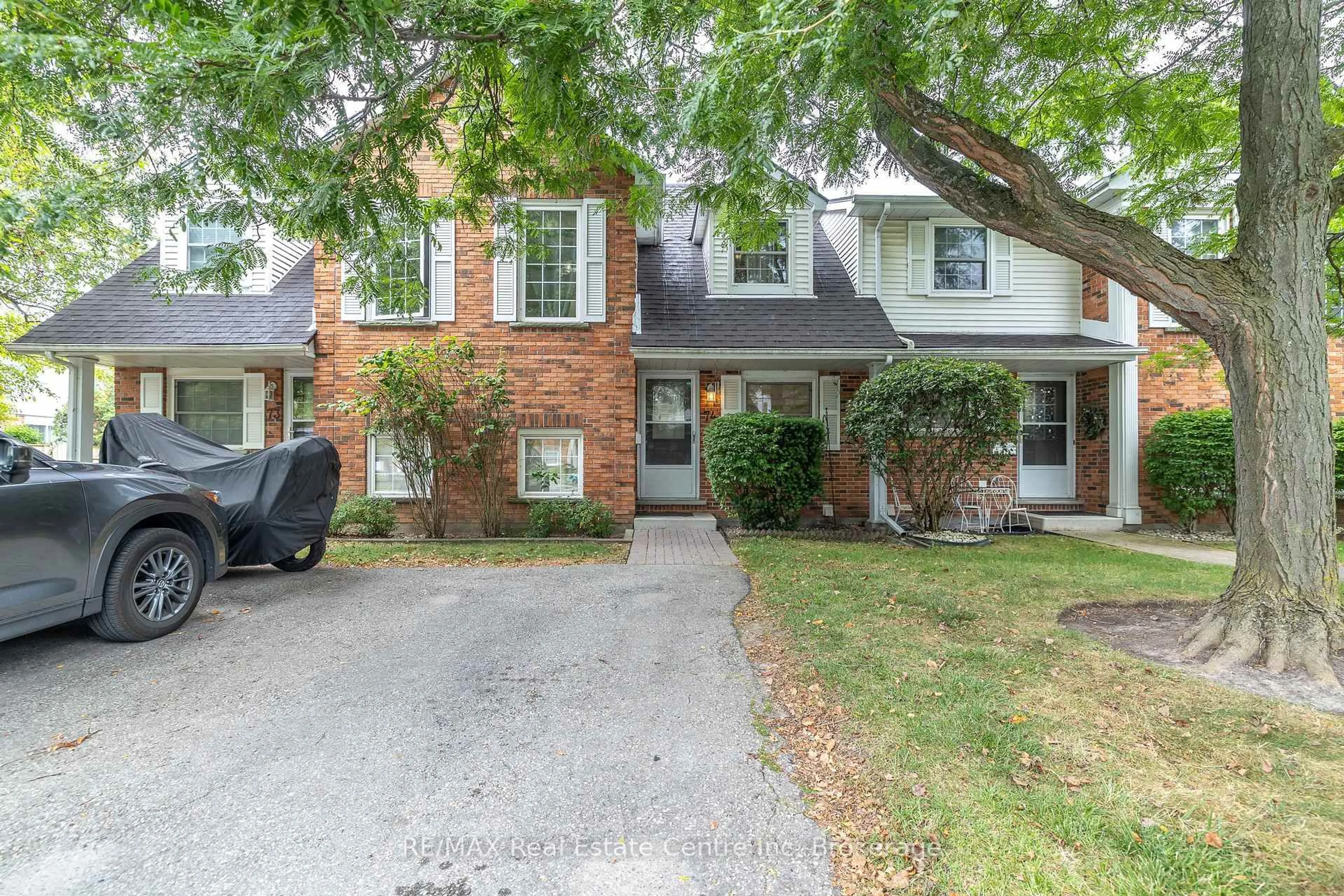 Home with brick exterior material, street for 129 Victoria Rd #74, Guelph Ontario N1E 6V4