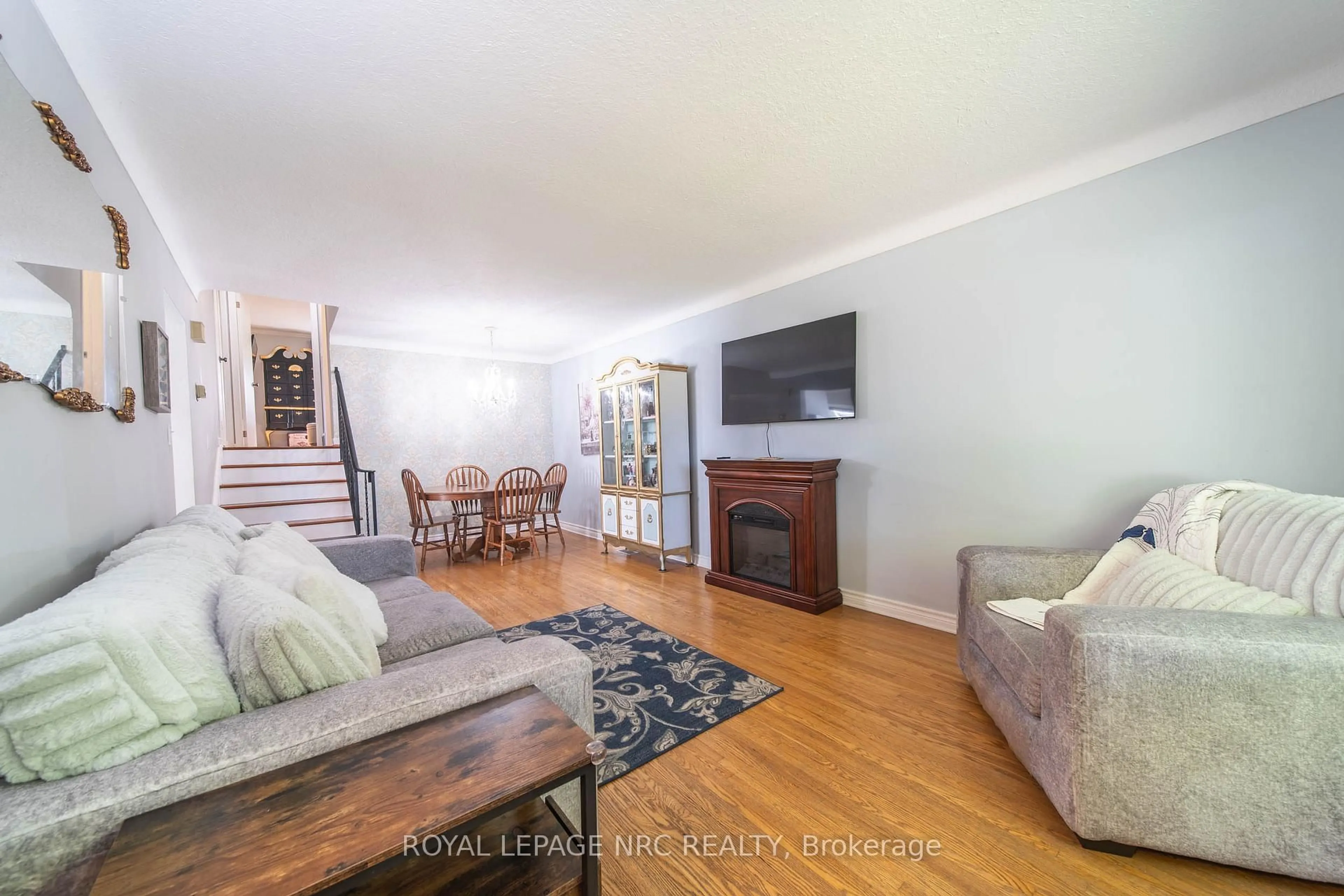 Living room with furniture, wood/laminate floor for 4228 York Dr, Niagara Falls Ontario L2E 6Y4