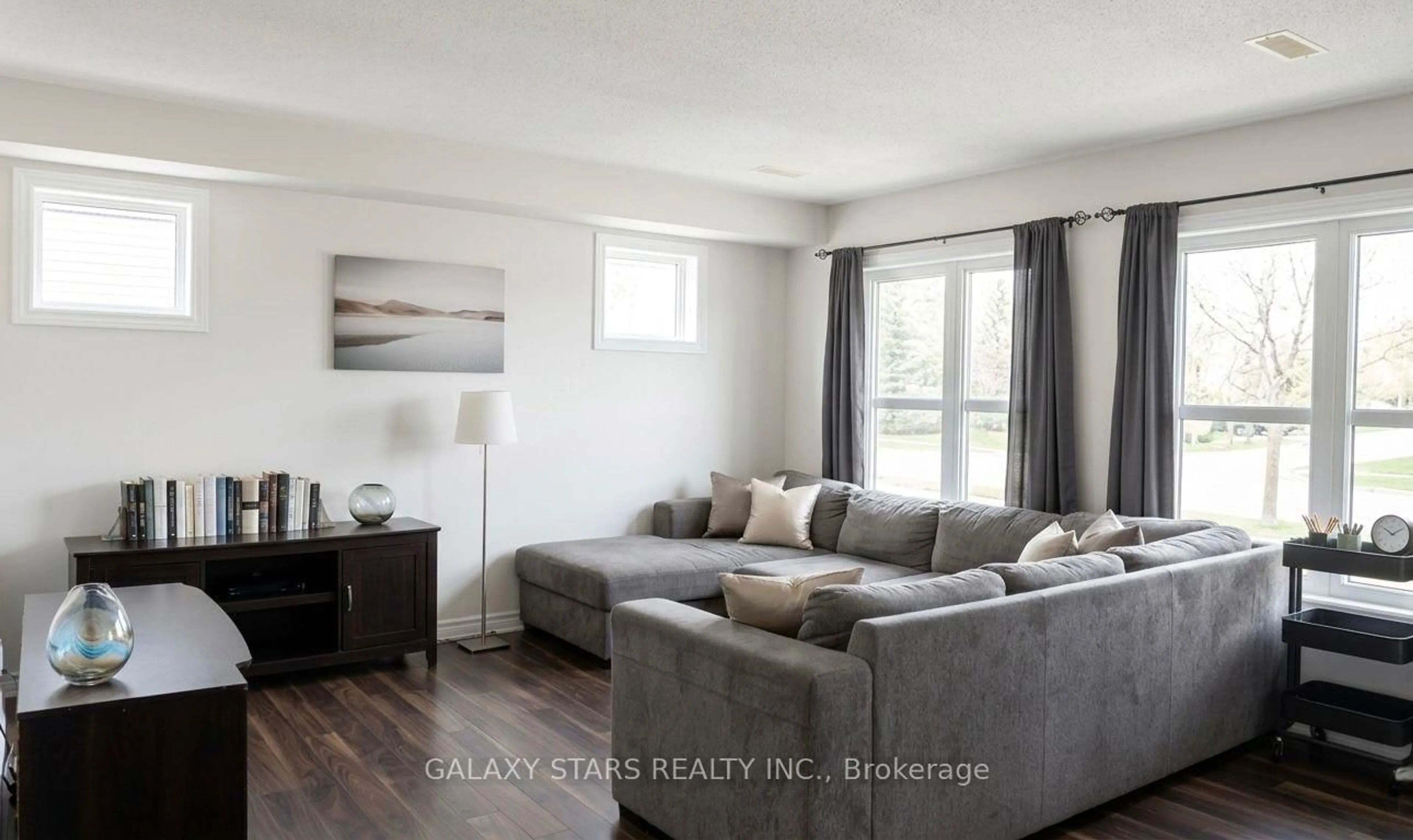 Living room with furniture, wood/laminate floor for 253 Infusion Private, Ottawa Ontario K2J 0H9