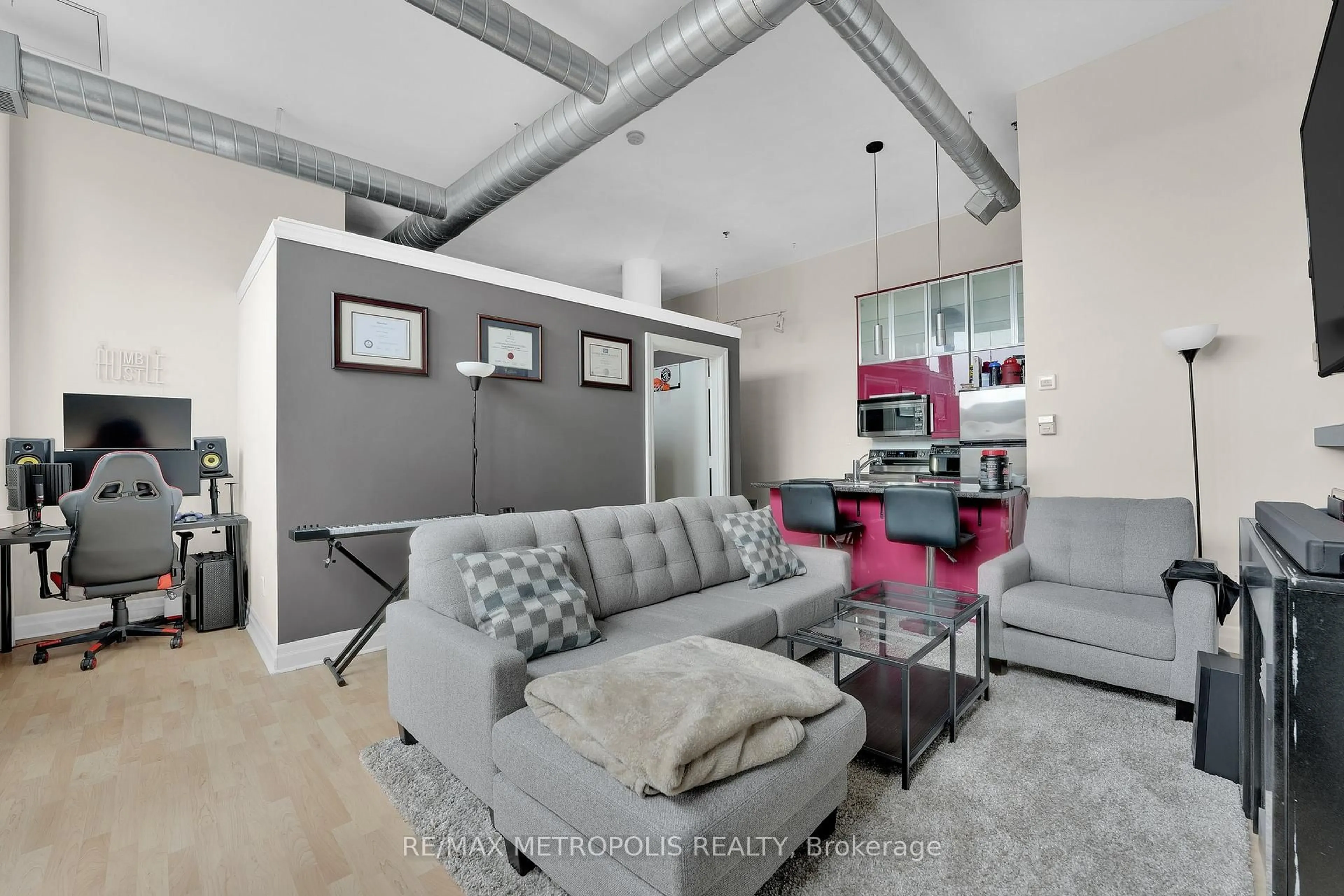 Living room with furniture, cement floor for 276 King St #207, Kitchener Ontario N2G 1B6