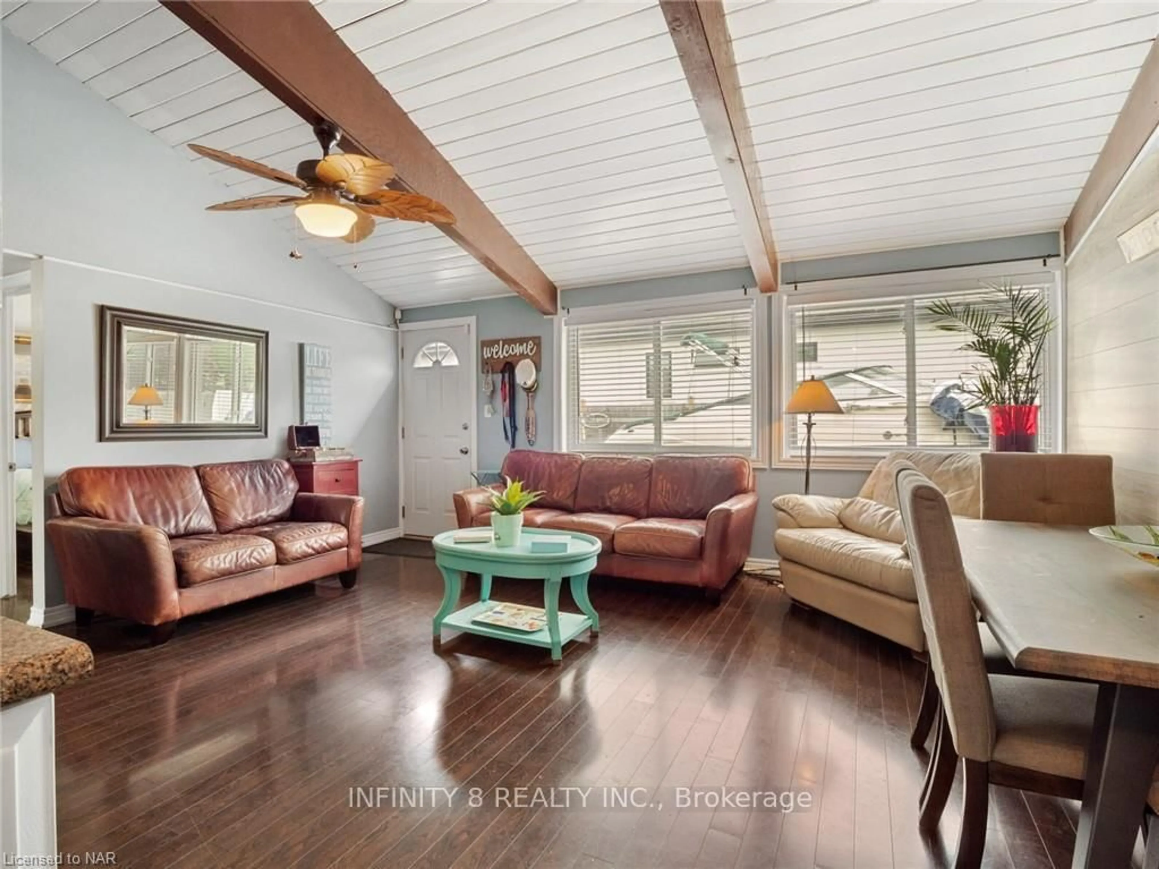 Living room with furniture, wood/laminate floor for 257 Ridge Road S Rd, Fort Erie Ontario L0S 1B0