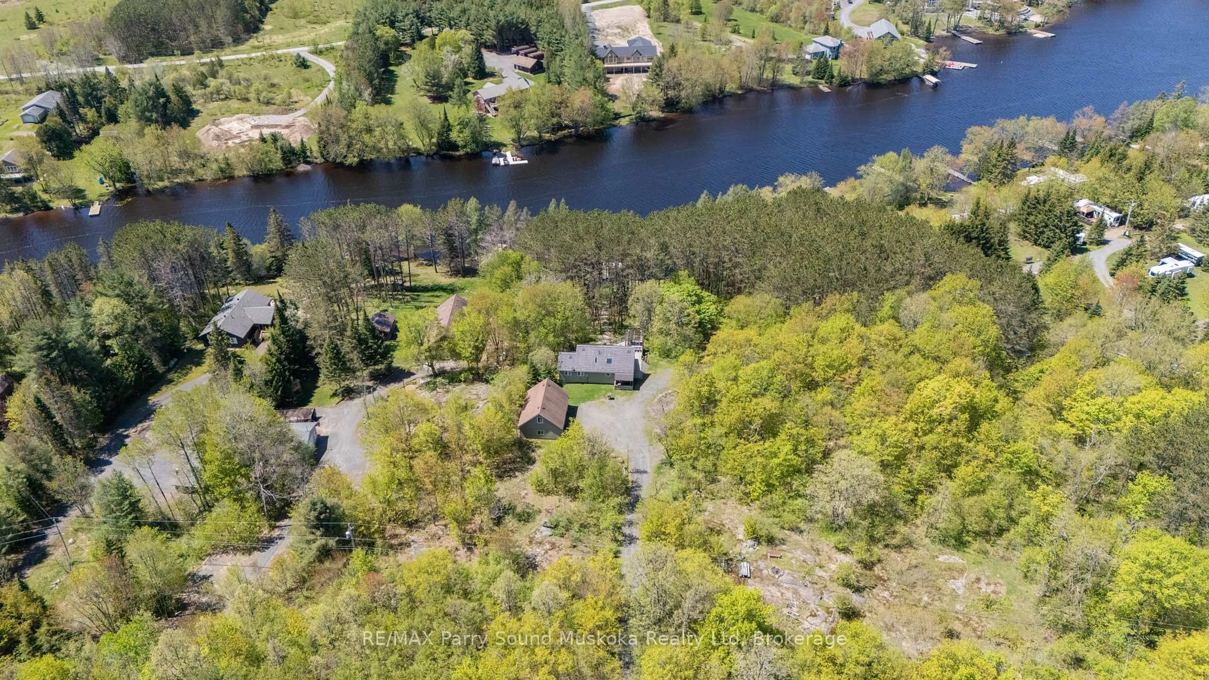 A pic from outside/outdoor area/front of a property/back of a property/a pic from drone, water/lake/river/ocean view for 587 Centre Rd, McKellar Ontario P2A 0B4