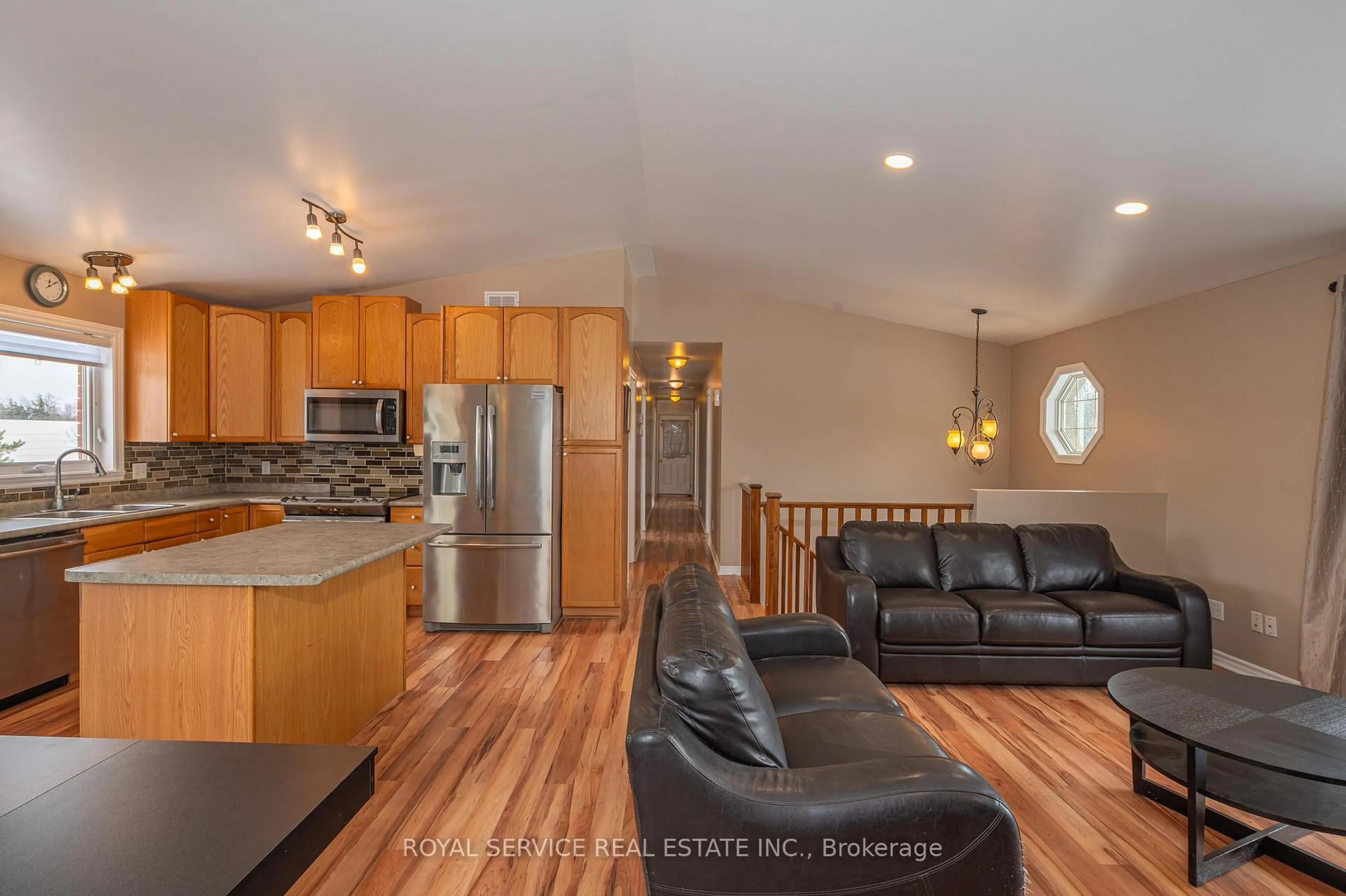 Open concept kitchen, wood/laminate floor for 323 Cadigan Rd, Selwyn Ontario K9J 6X2