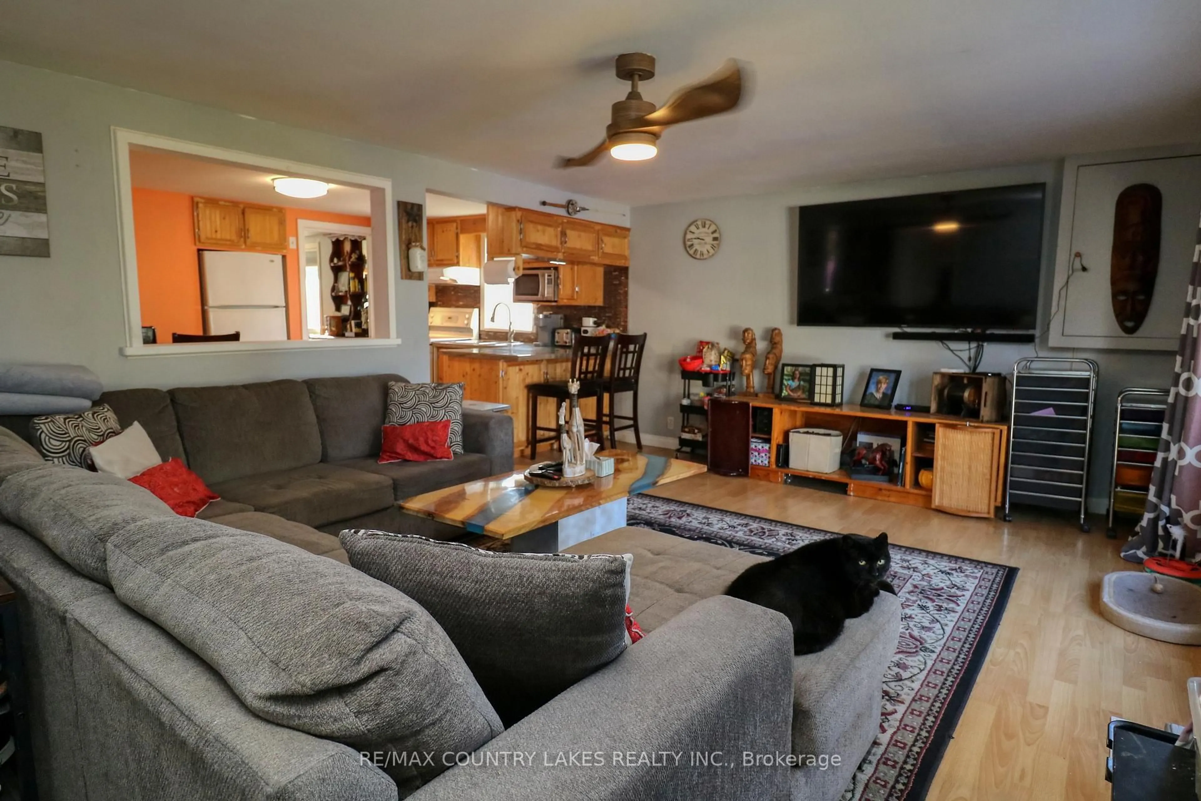 Living room with furniture, wood/laminate floor for 41 Antiquary Rd, Kawartha Lakes Ontario K0M 2B0