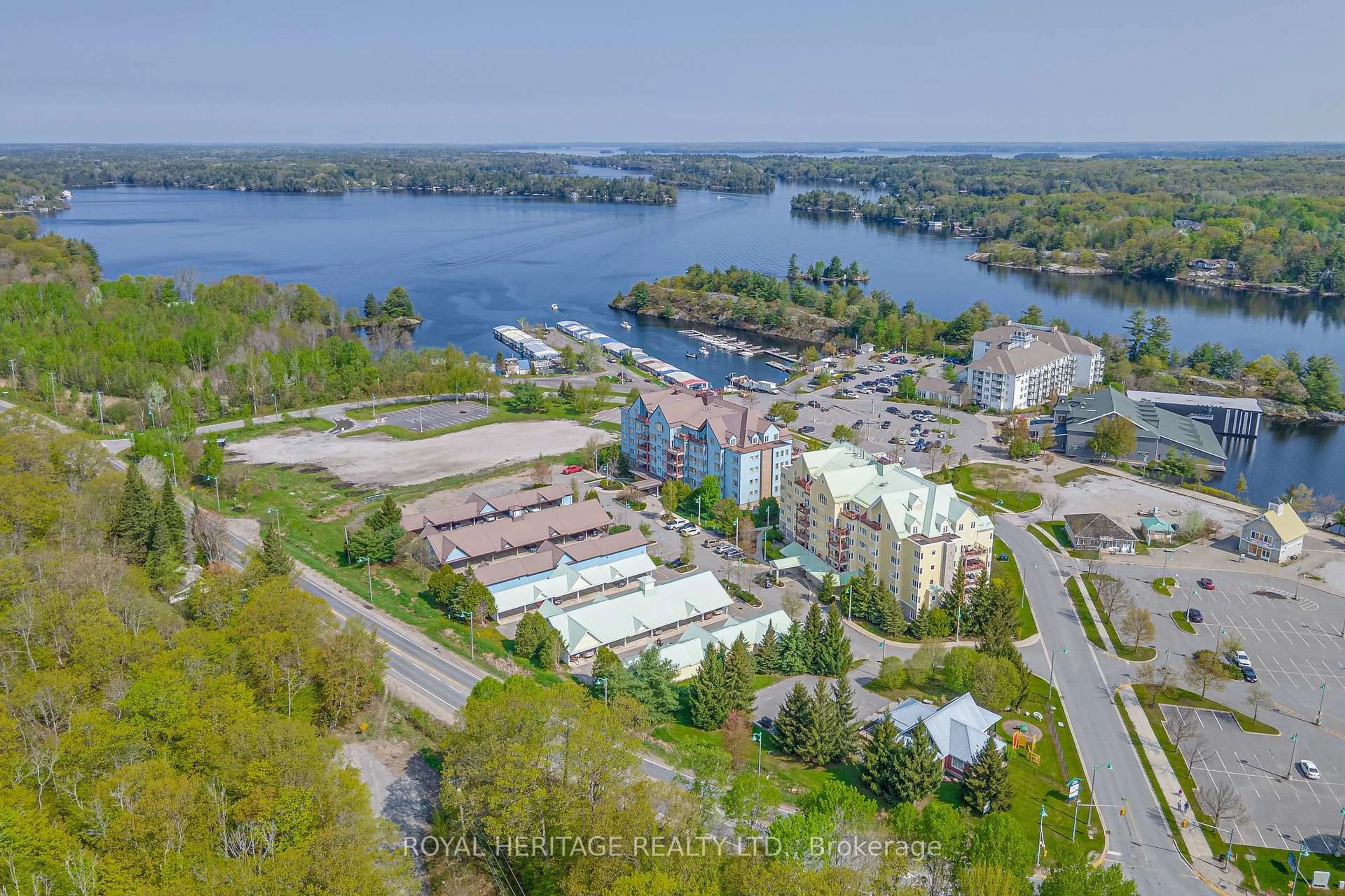 A pic from outside/outdoor area/front of a property/back of a property/a pic from drone, water/lake/river/ocean view for 130 Steamship Bay Rd Rd #605, Gravenhurst Ontario P1P 1Z9