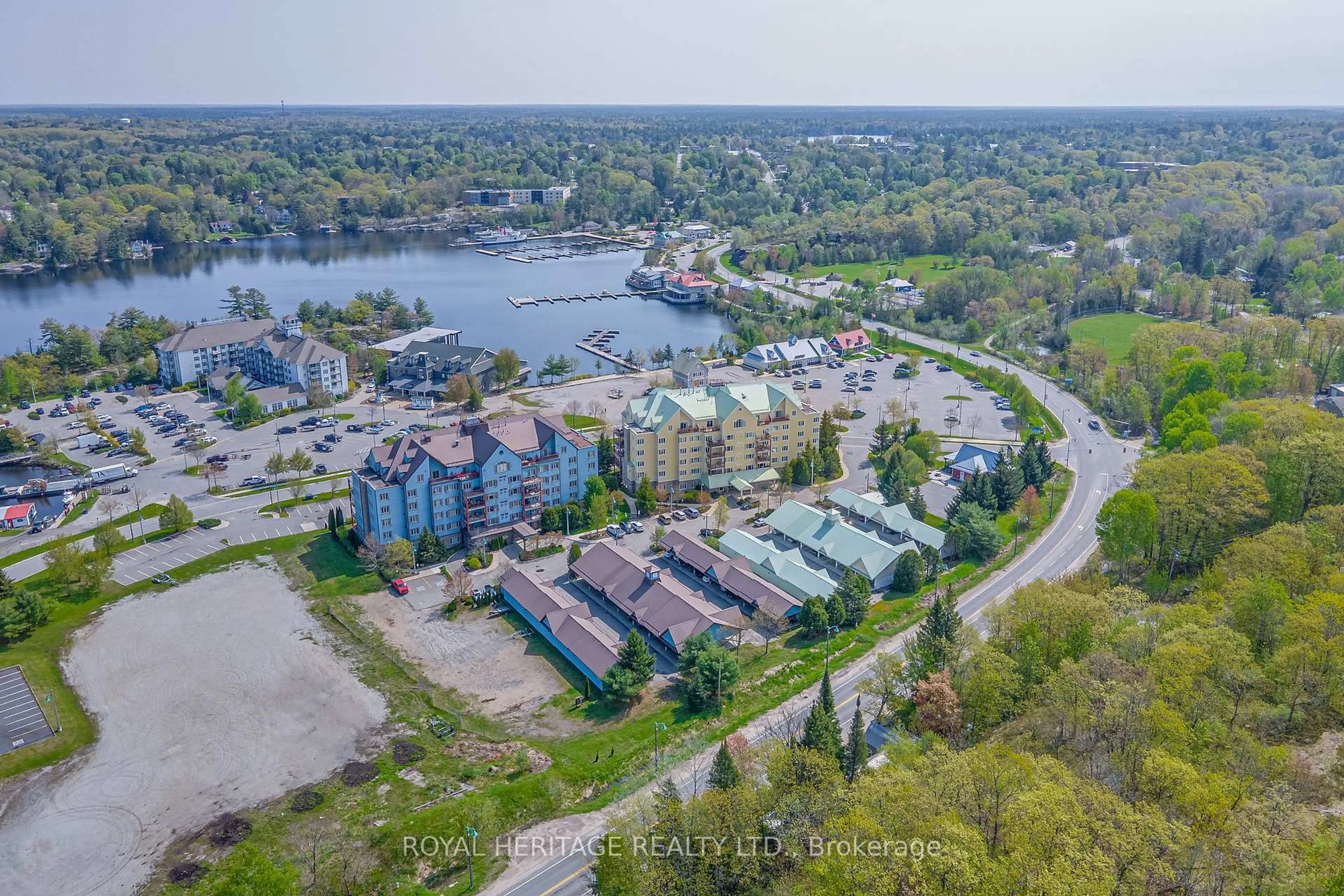 A pic from outside/outdoor area/front of a property/back of a property/a pic from drone, water/lake/river/ocean view for 130 Steamship Bay Rd Rd #605, Gravenhurst Ontario P1P 1Z9