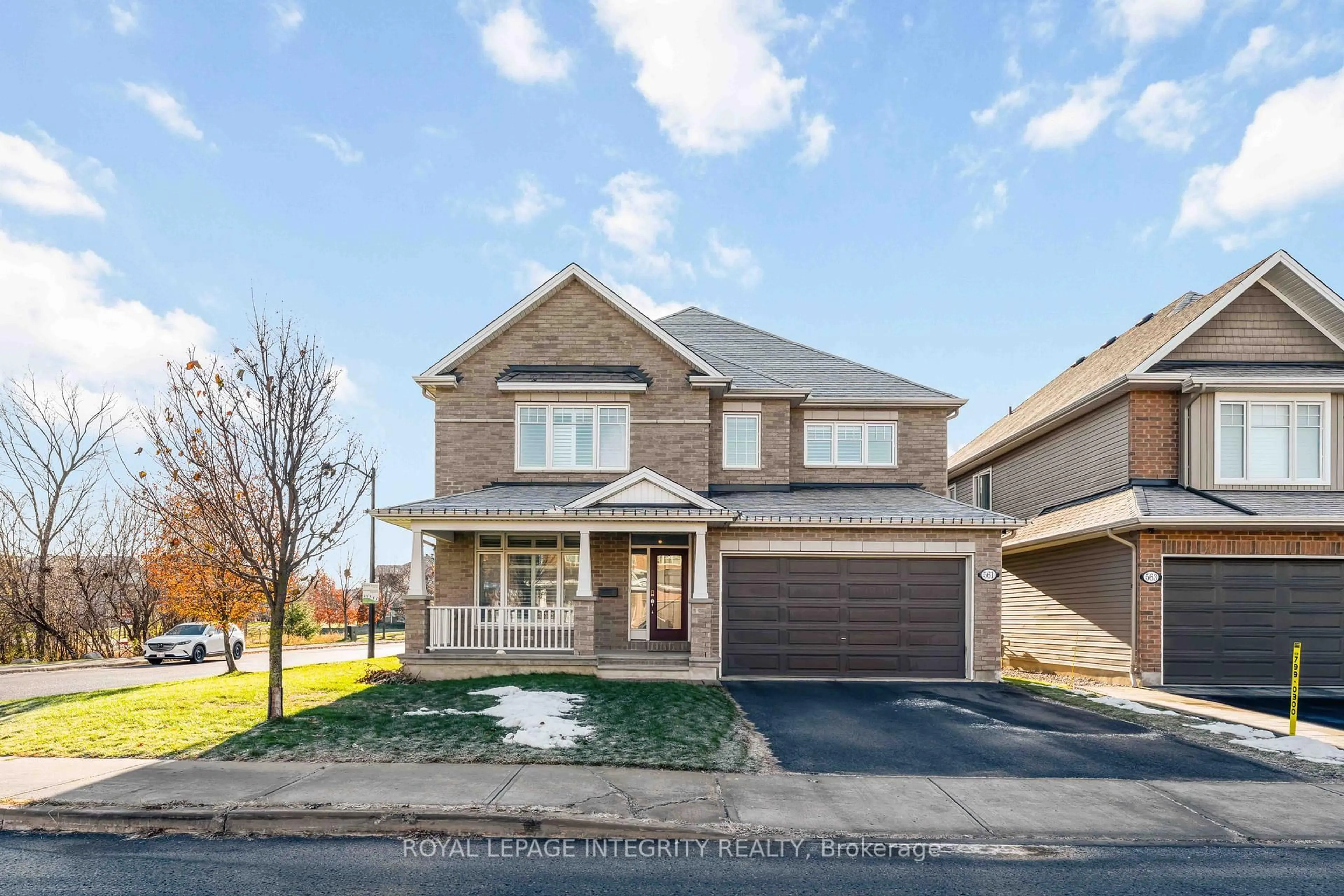 Home with brick exterior material, street for 561 Egret Way, Ottawa Ontario K2J 0E3