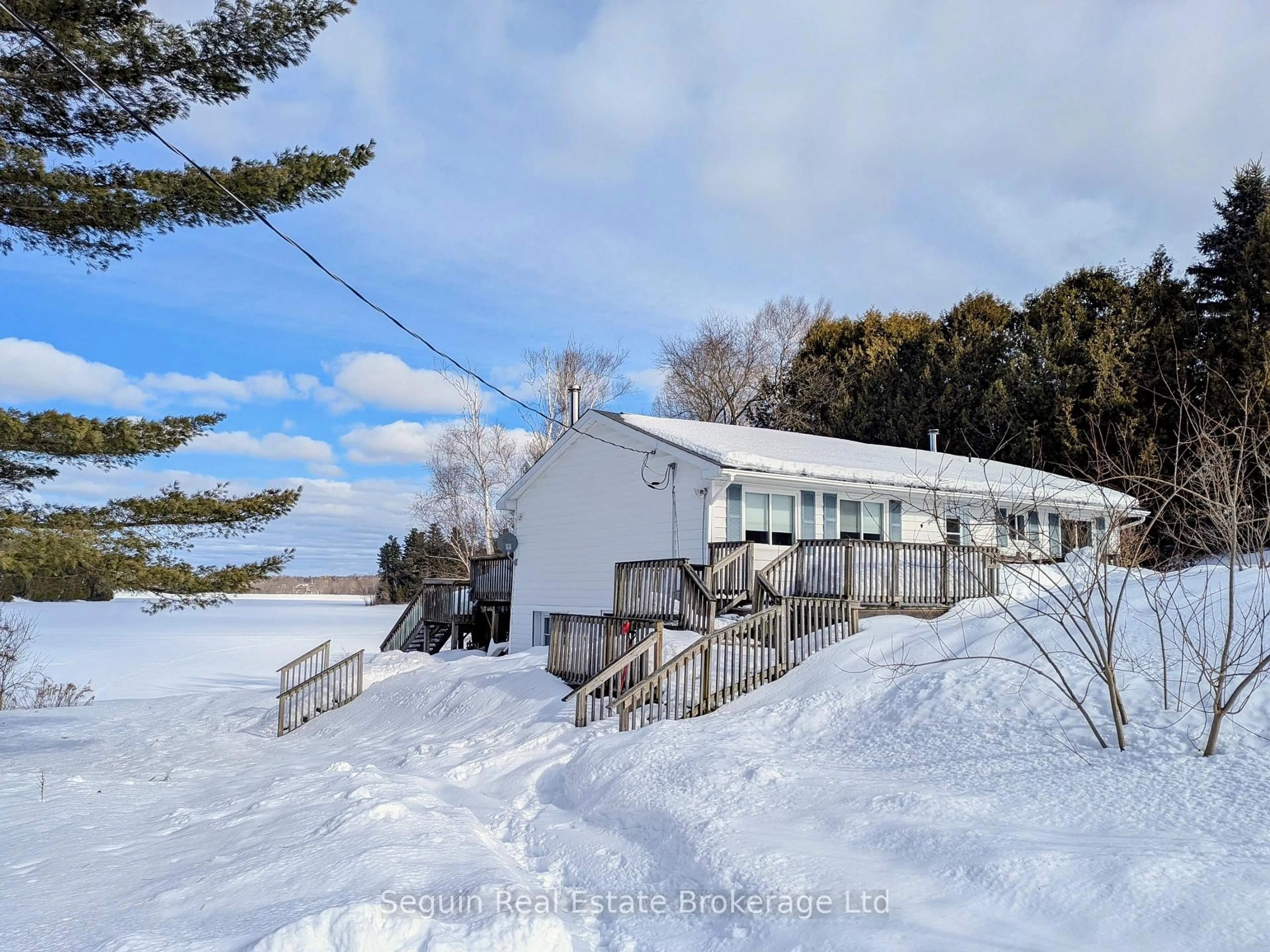 A pic from outside/outdoor area/front of a property/back of a property/a pic from drone, water/lake/river/ocean view for 14 Jordan Lane, Seguin Ontario P2A 0B6