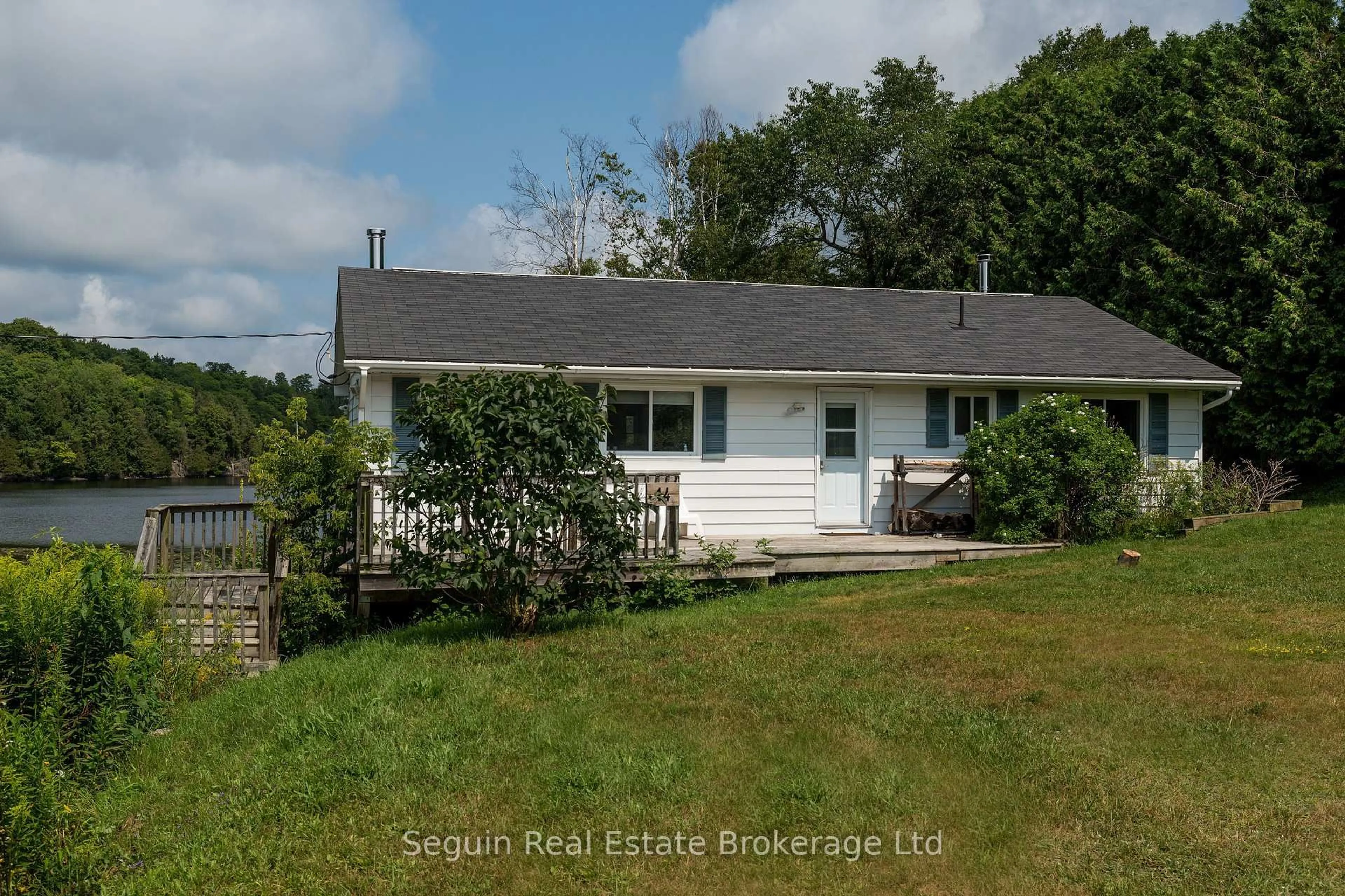 A pic from outside/outdoor area/front of a property/back of a property/a pic from drone, water/lake/river/ocean view for 14 Jordan Lane, Seguin Ontario P2A 0B6