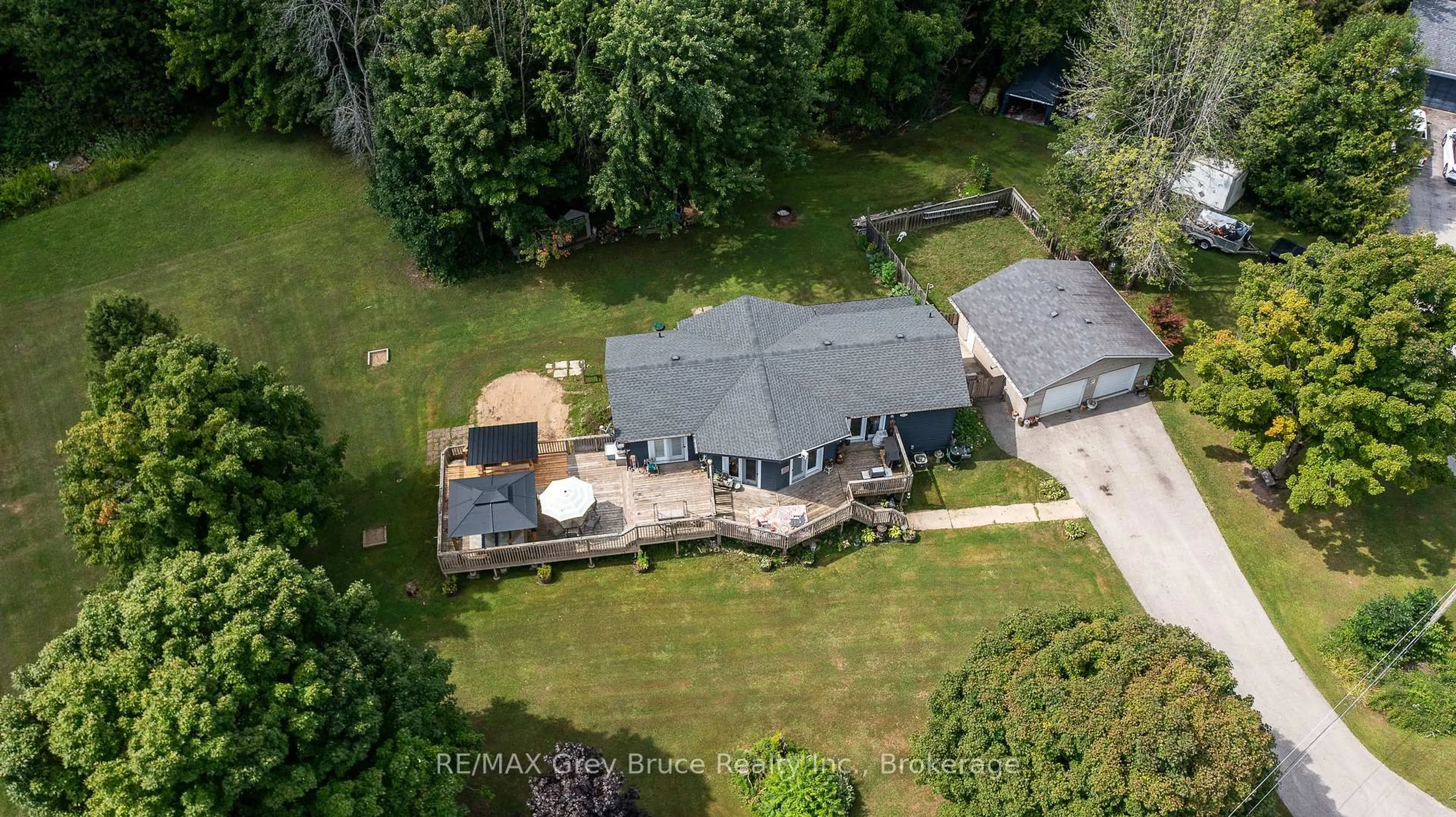 A pic from outside/outdoor area/front of a property/back of a property/a pic from drone, water/lake/river/ocean view for 201 DIVISION St, Georgian Bluffs Ontario N0H 2K0