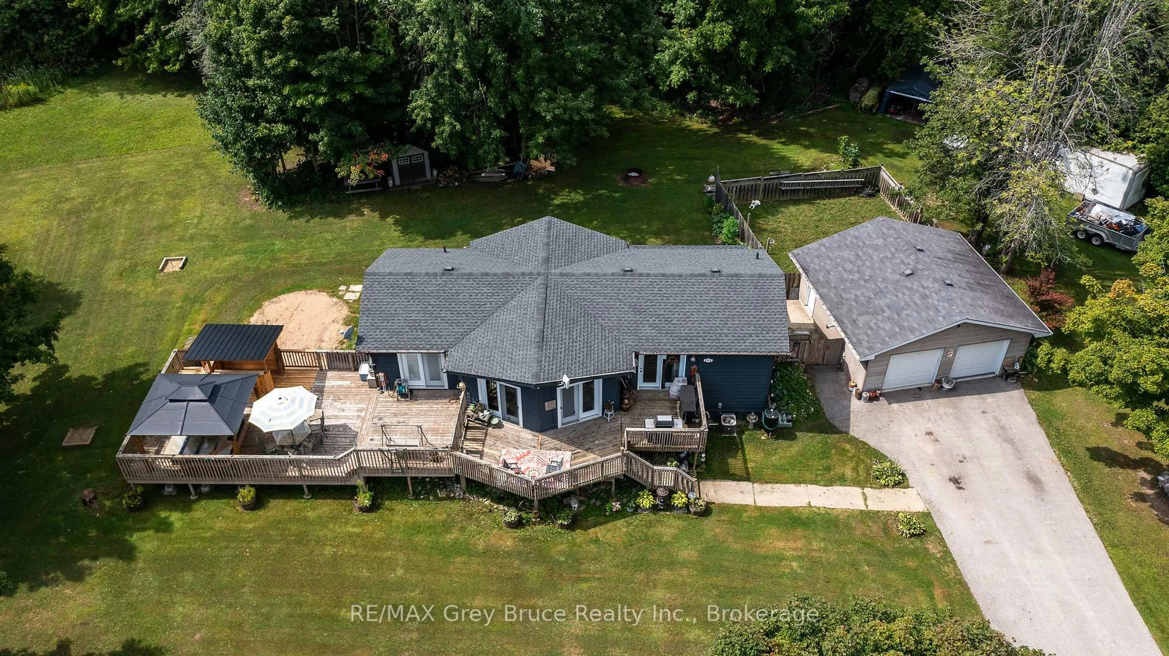 A pic from outside/outdoor area/front of a property/back of a property/a pic from drone, water/lake/river/ocean view for 201 DIVISION St, Georgian Bluffs Ontario N0H 2K0
