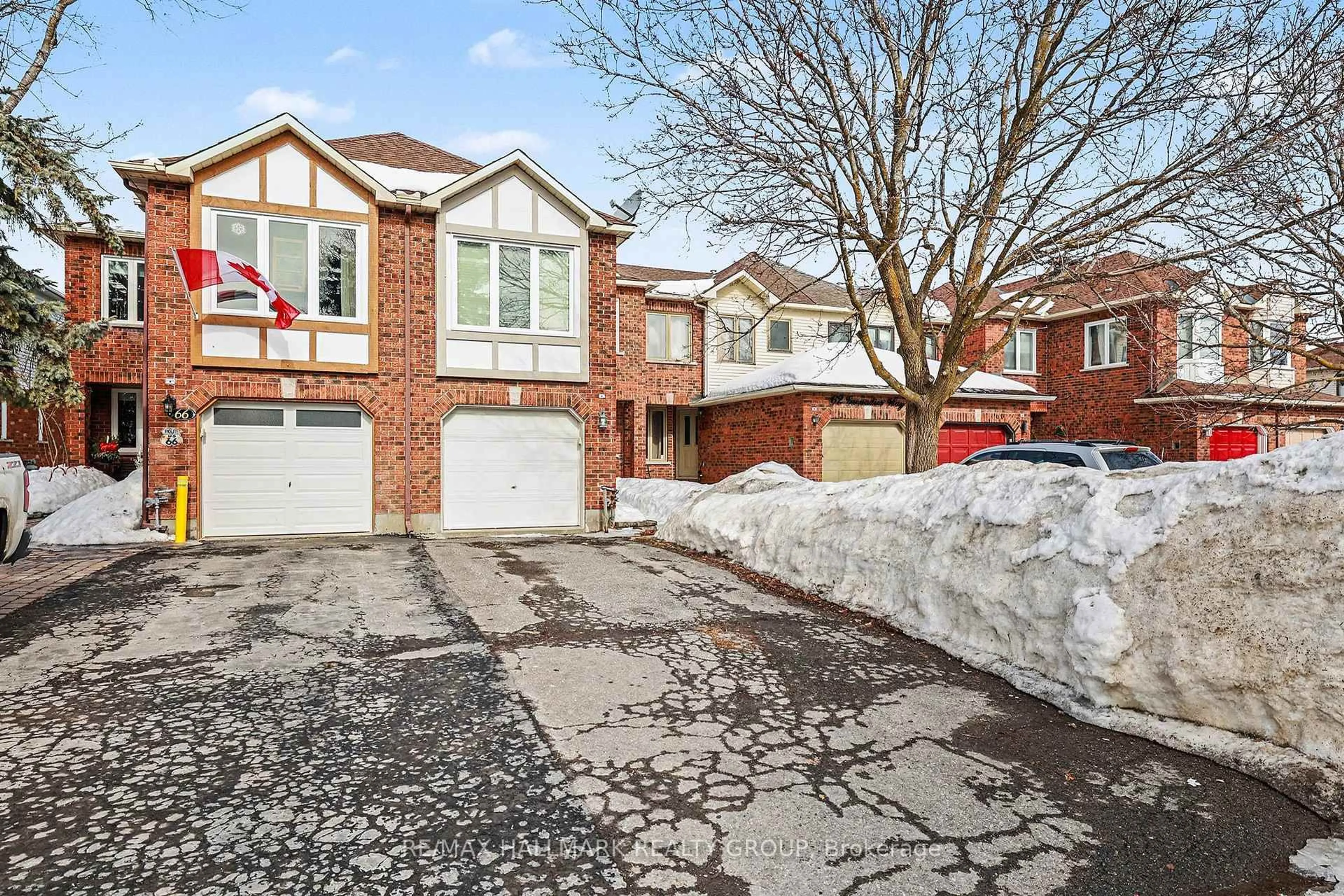 Home with brick exterior material, street for 64 Grenadier Way, Ottawa Ontario K2J 4L5