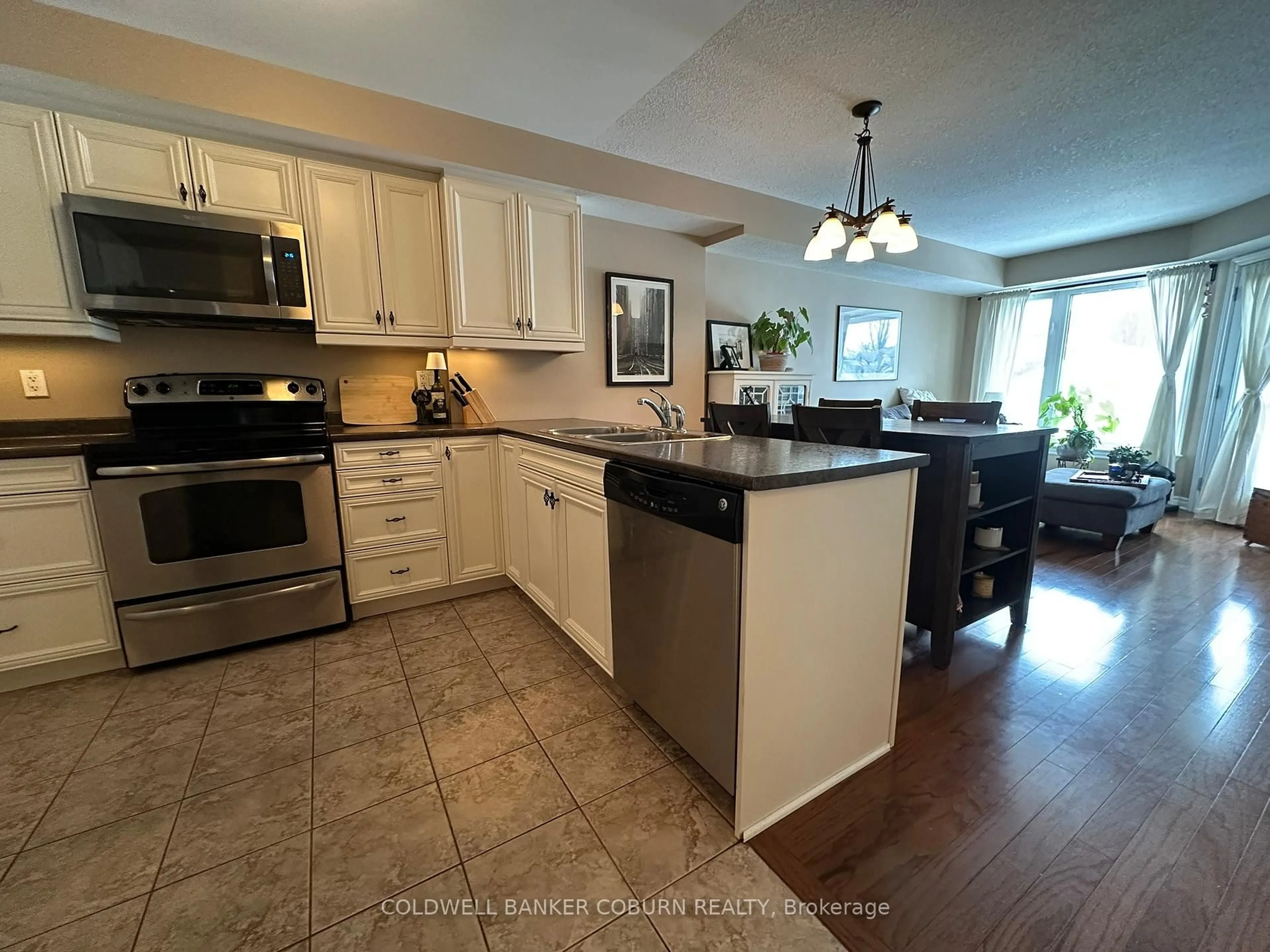Open concept kitchen, ceramic/tile floor for 398 Van Buren St #105, North Grenville Ontario K0G 1J0