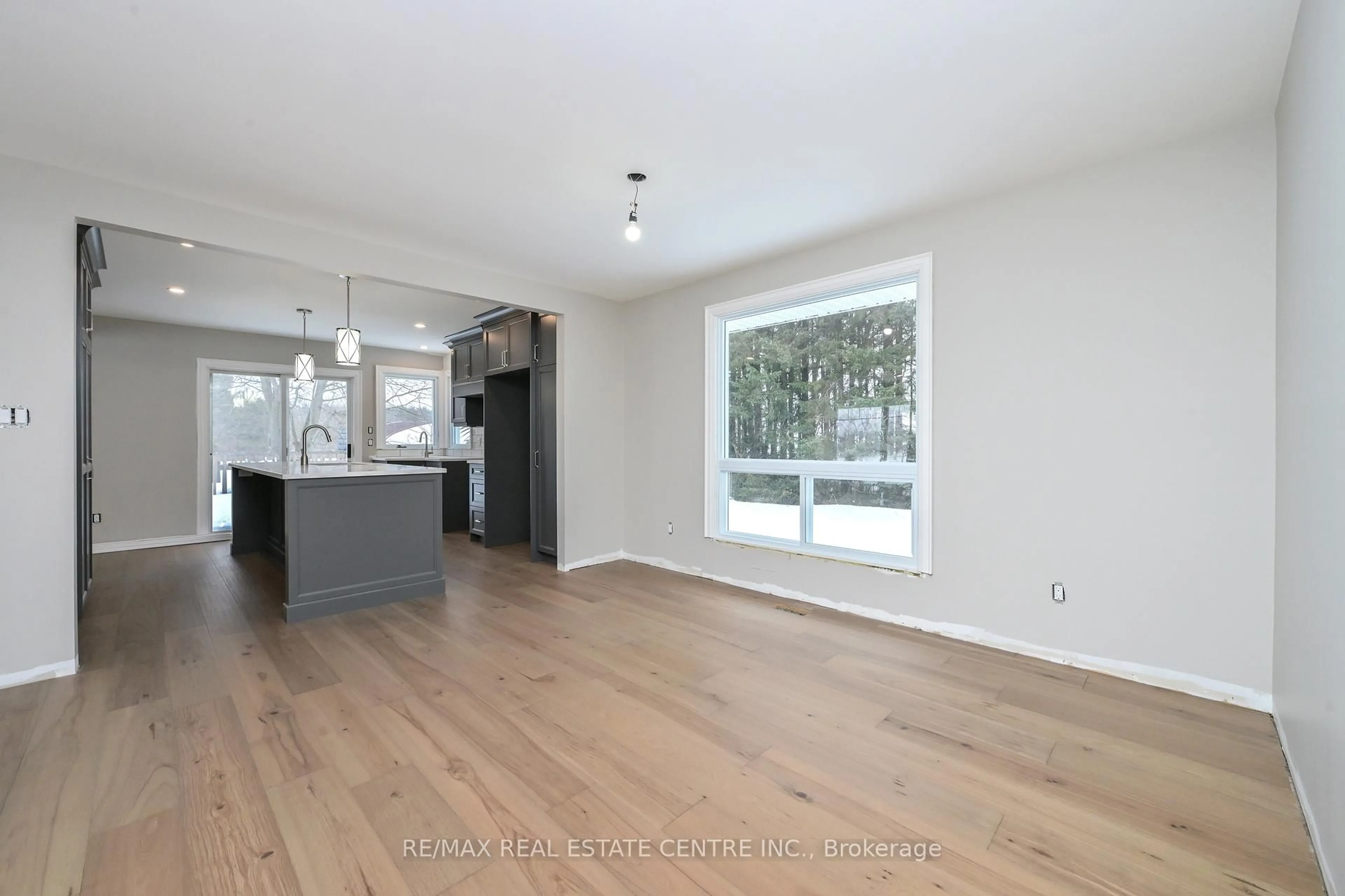 Open concept kitchen, wood/laminate floor for 714394 1st Line Ehs, Mono Ontario L9W 5T6