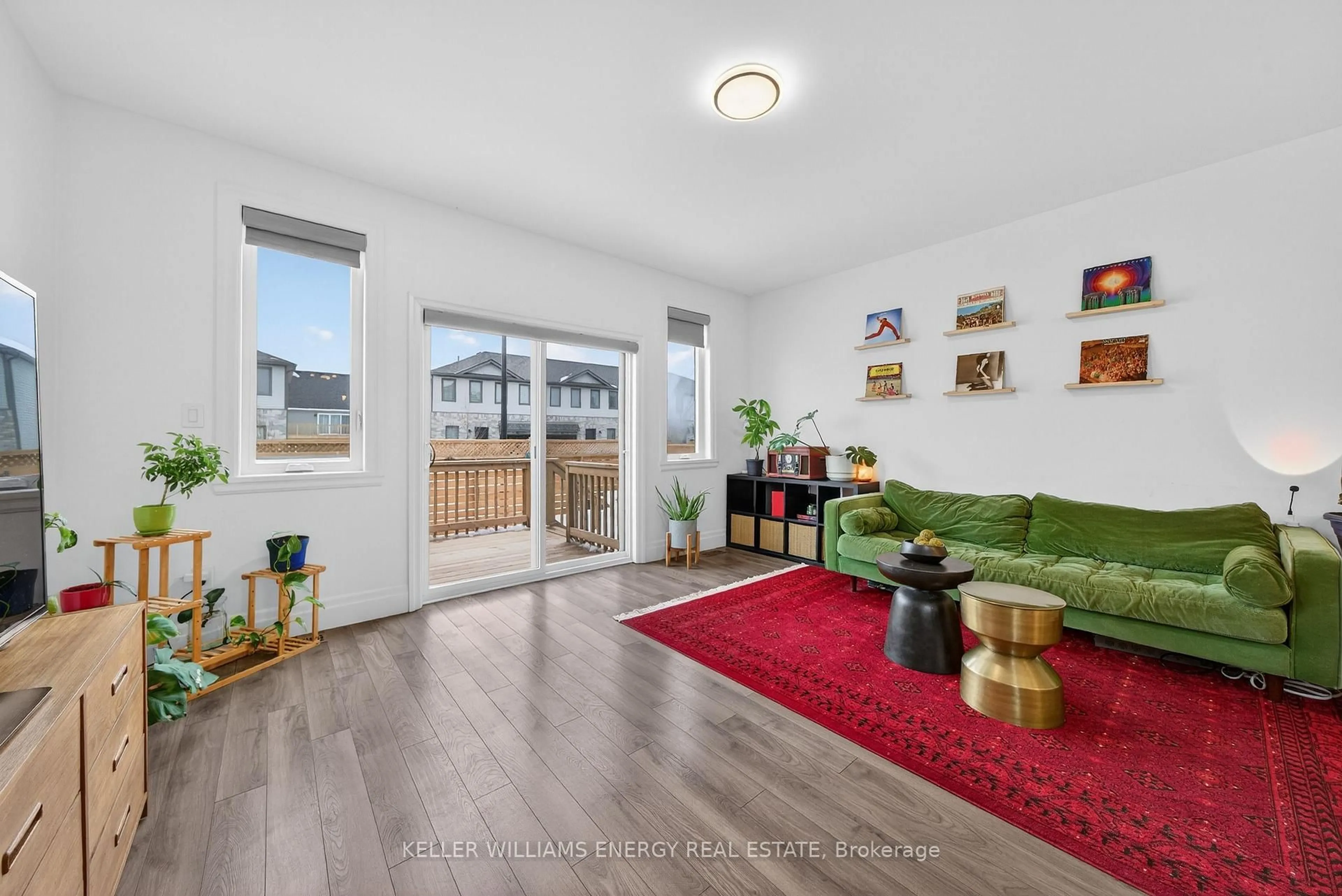 Living room with furniture, wood/laminate floor for 50 Markland Ave, Prince Edward County Ontario K0K 2T0