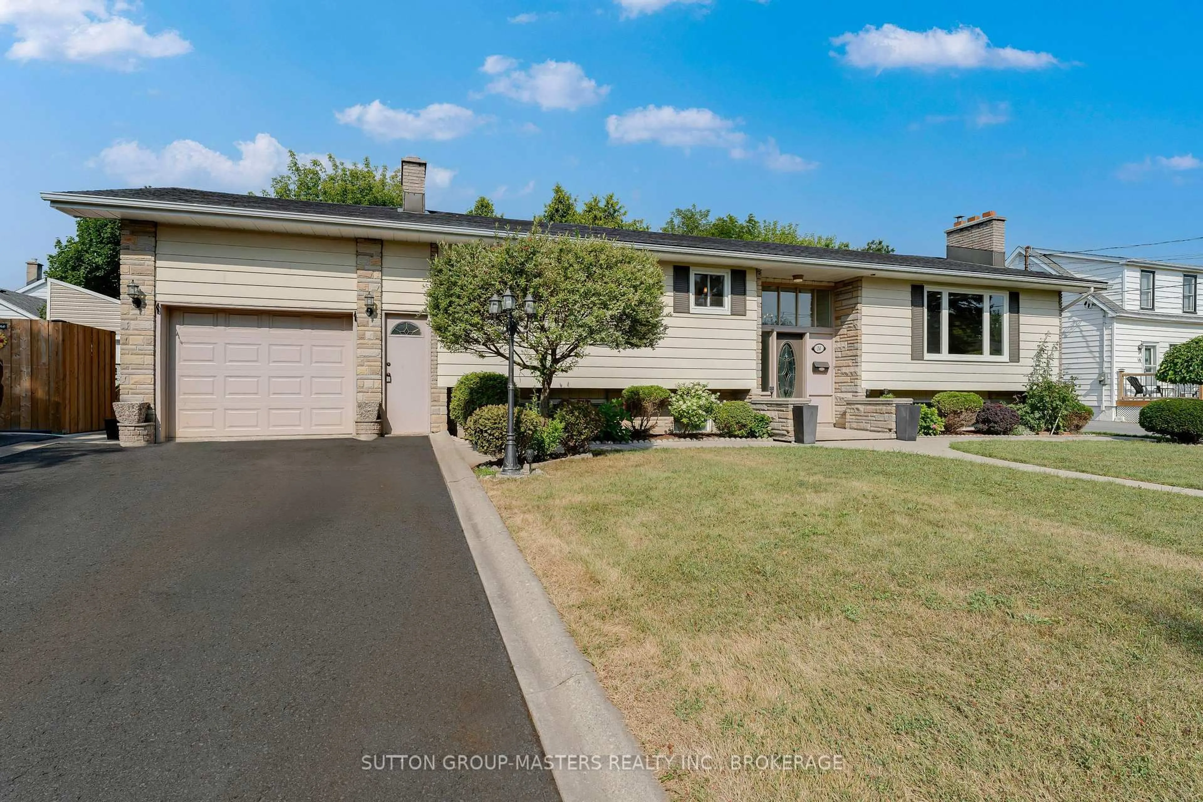 Home with vinyl exterior material, street for 14 Baker St, Kingston Ontario K7K 4Z3