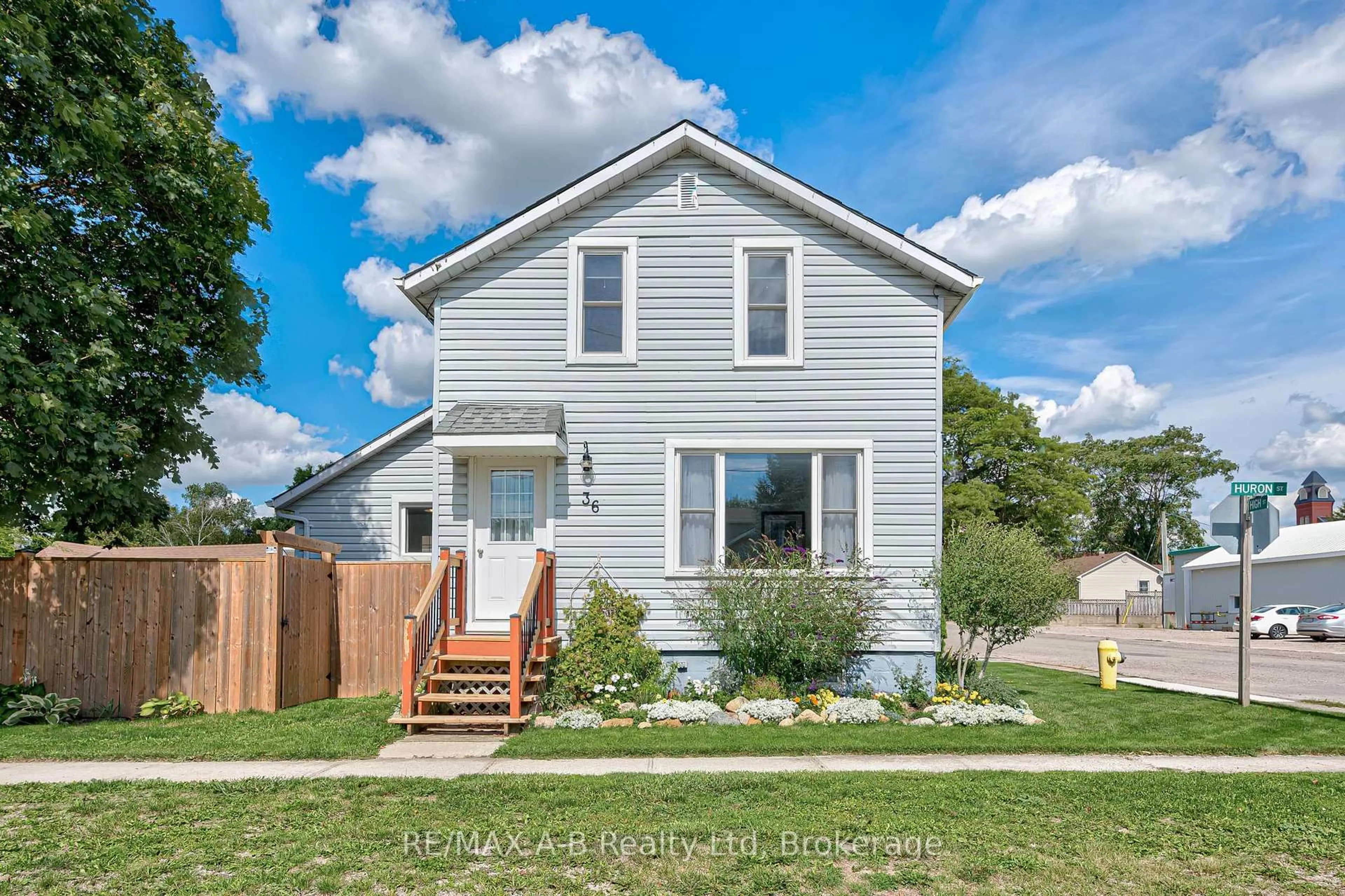 Home with vinyl exterior material, street for 36 Huron St, Huron East Ontario N0K 1W0
