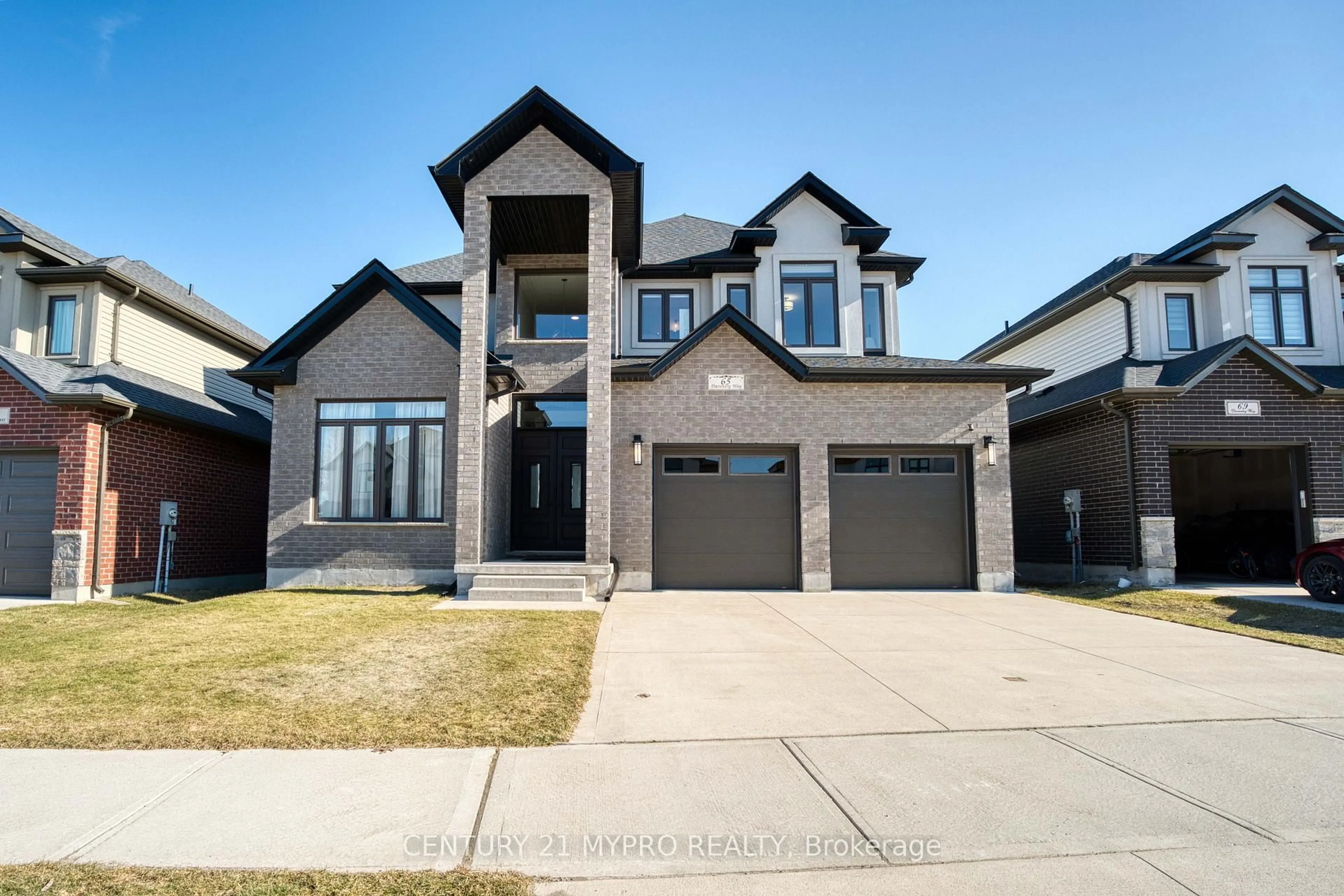 Home with brick exterior material, street for 65 Daventry Way, Middlesex Centre Ontario N0L 1R0
