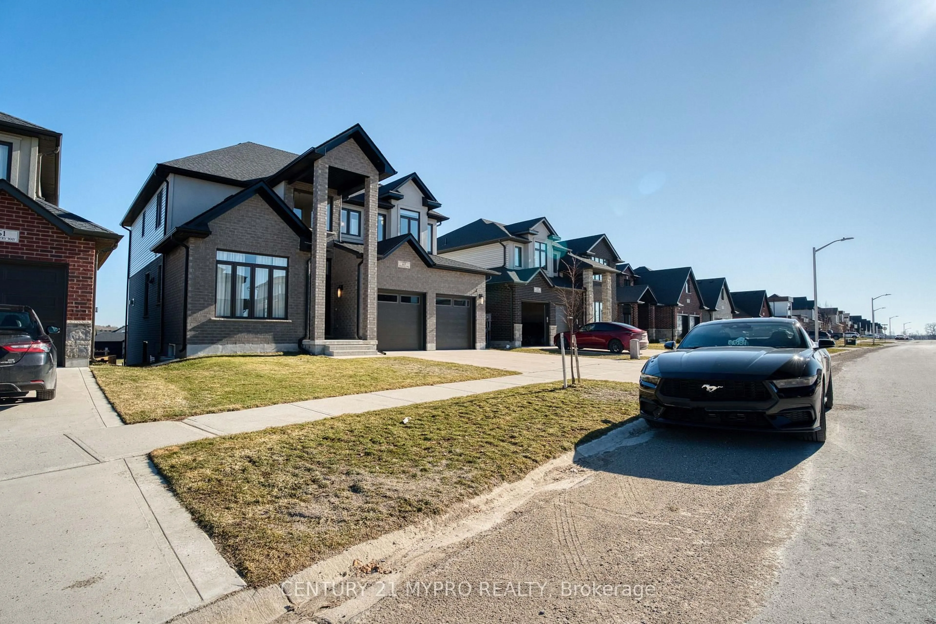 Home with brick exterior material, street for 65 Daventry Way, Middlesex Centre Ontario N0L 1R0