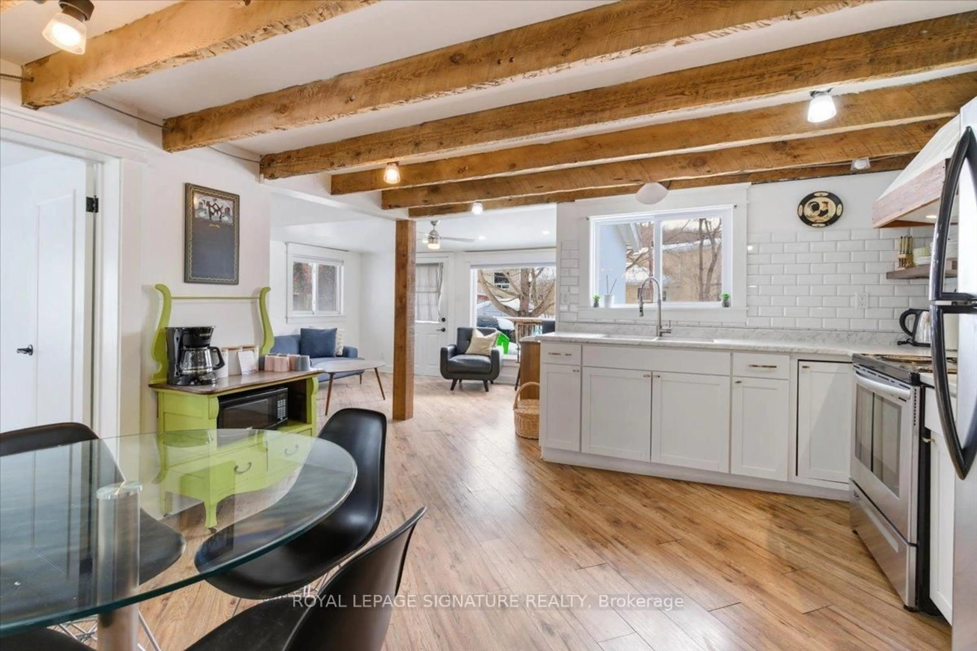 Open concept kitchen, wood/laminate floor for 42 York St, Prince Edward County Ontario K0K 2T0