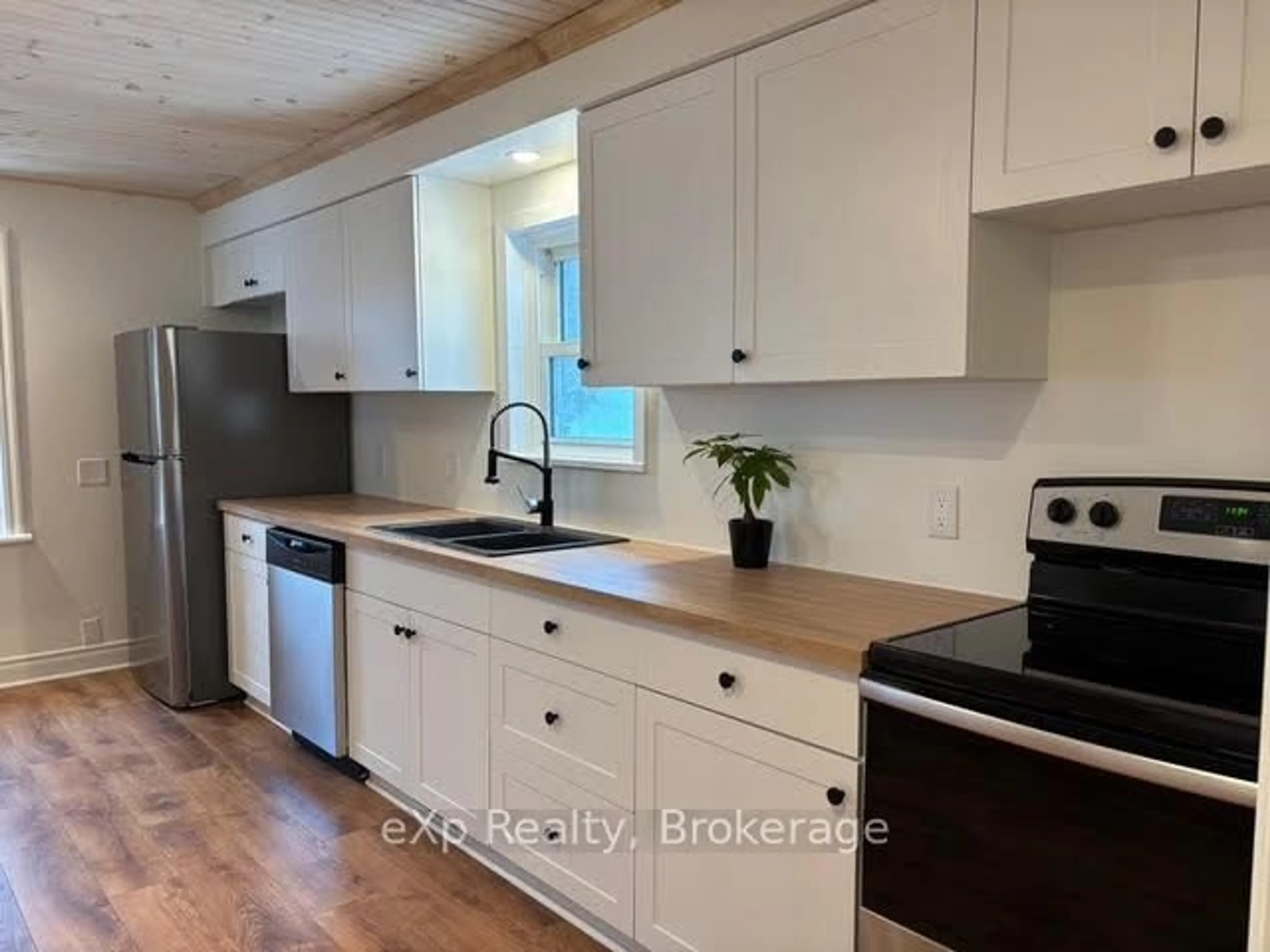 Open concept kitchen, wood/laminate floor for 601 Drive-In Rd, West Nipissing Ontario P2B 2R1