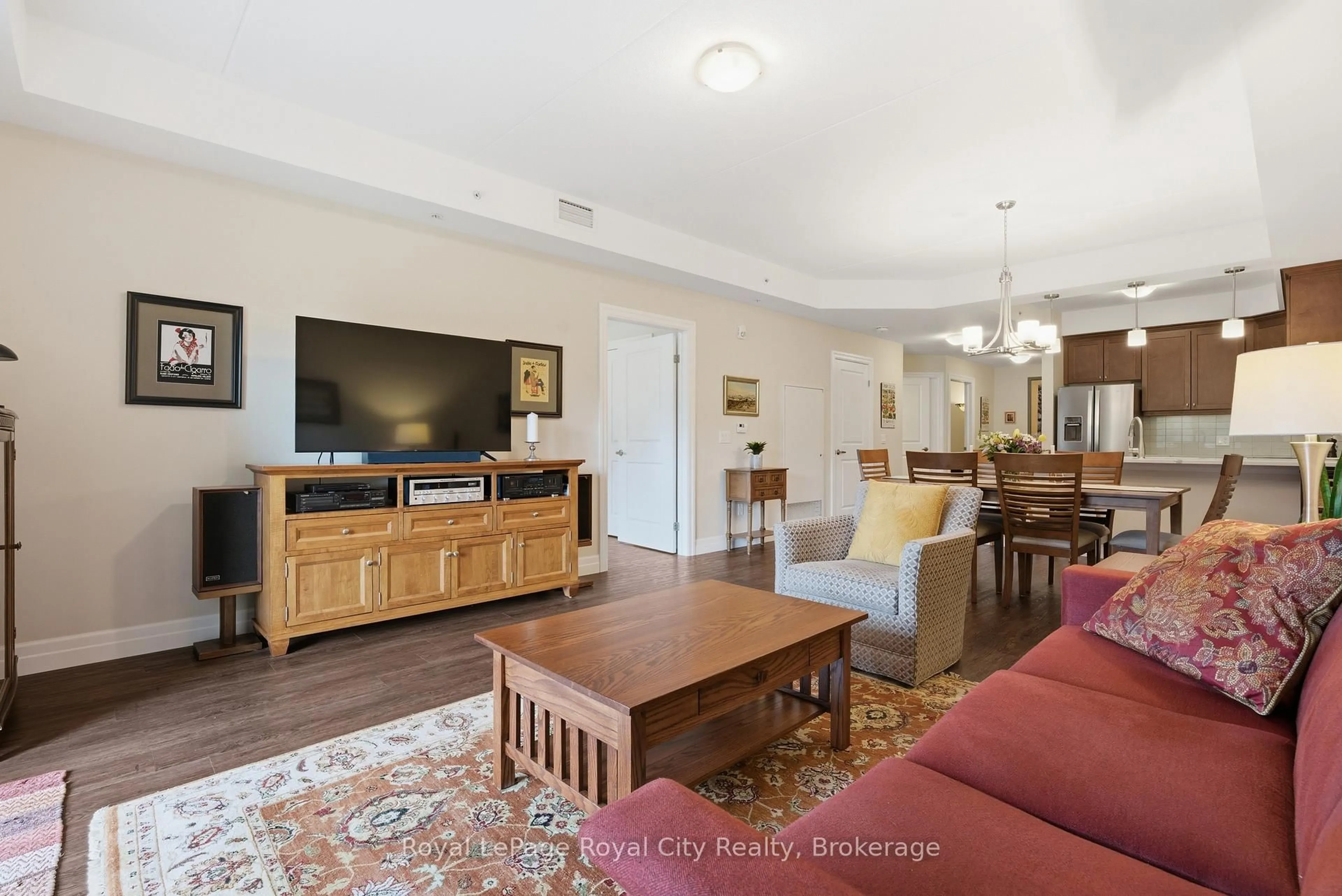 Living room with furniture, wood/laminate floor for 19 Stumpf St #106, Centre Wellington Ontario N0B 1S0