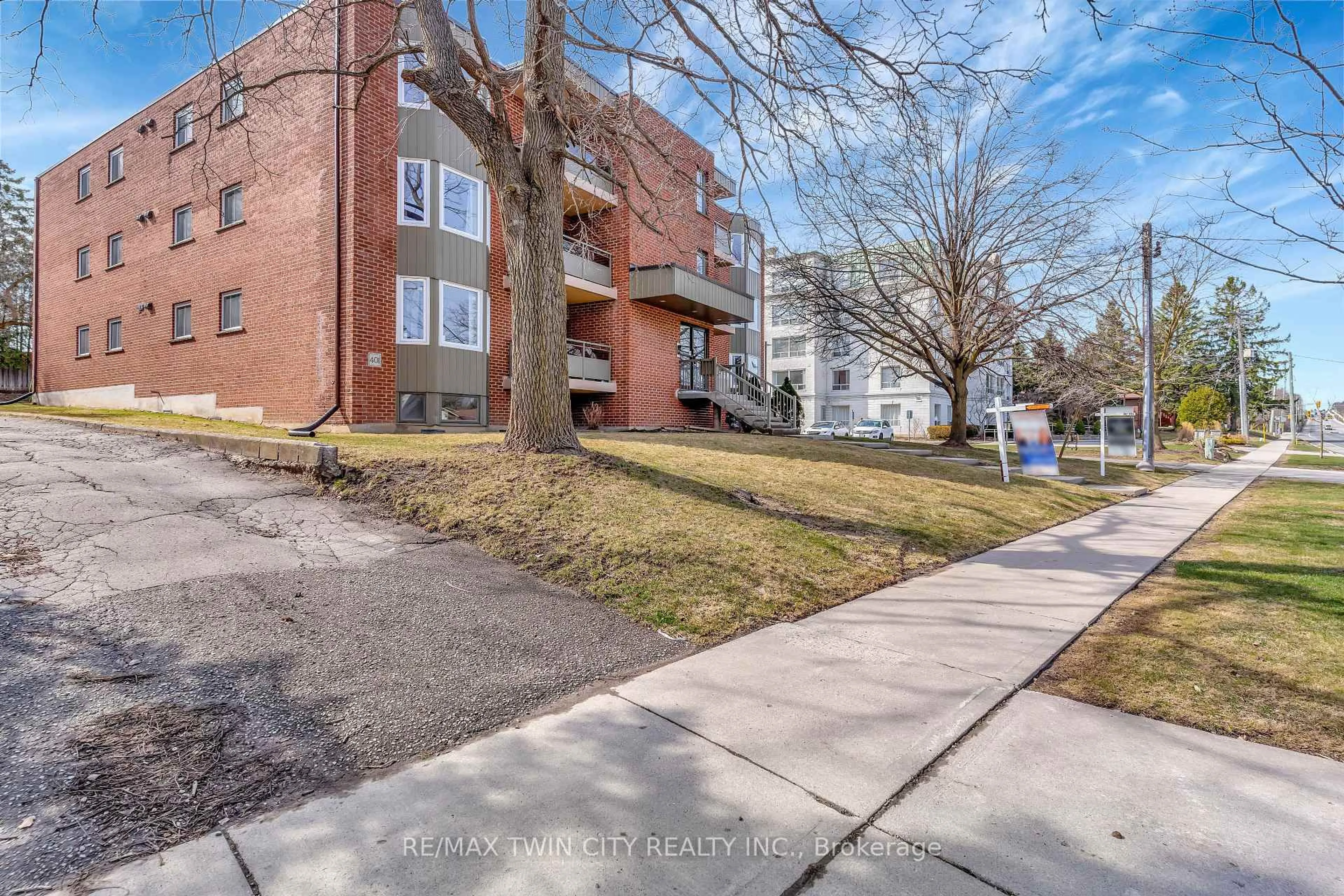 A pic from outside/outdoor area/front of a property/back of a property/a pic from drone, street for 401 Erb St #203, Waterloo Ontario N2L 1W7