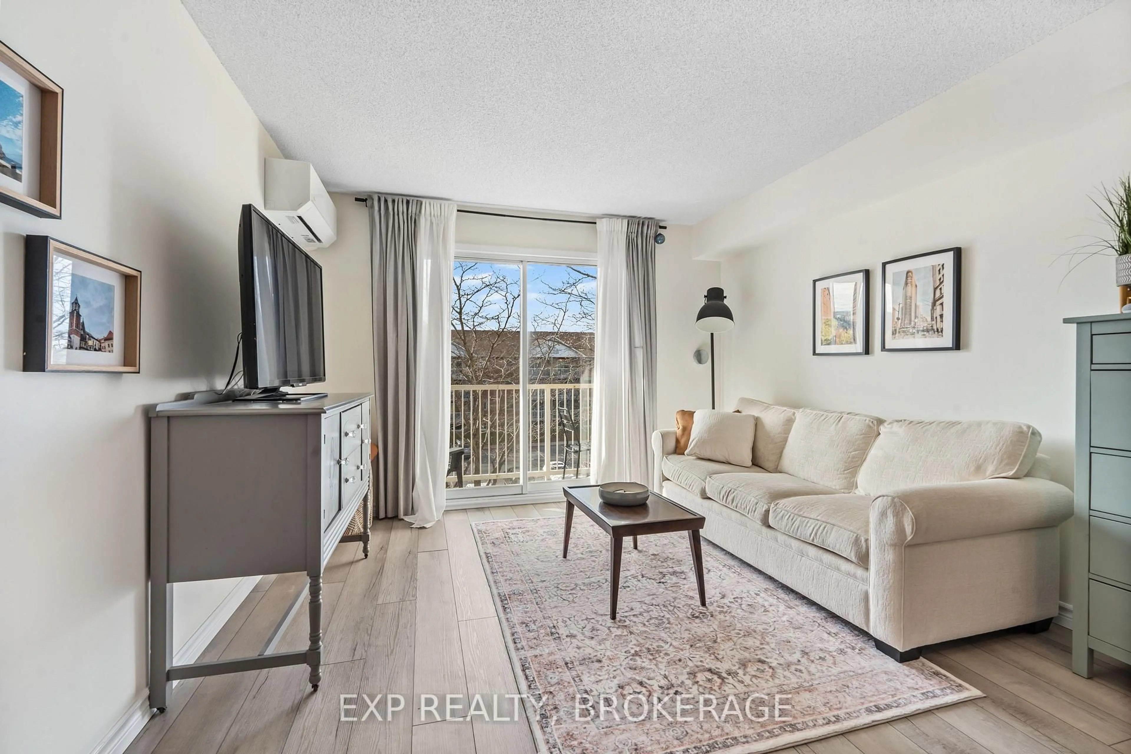 Living room with furniture, wood/laminate floor for 316 KINGSDALE Ave #408, Kingston Ontario K7M 8S2