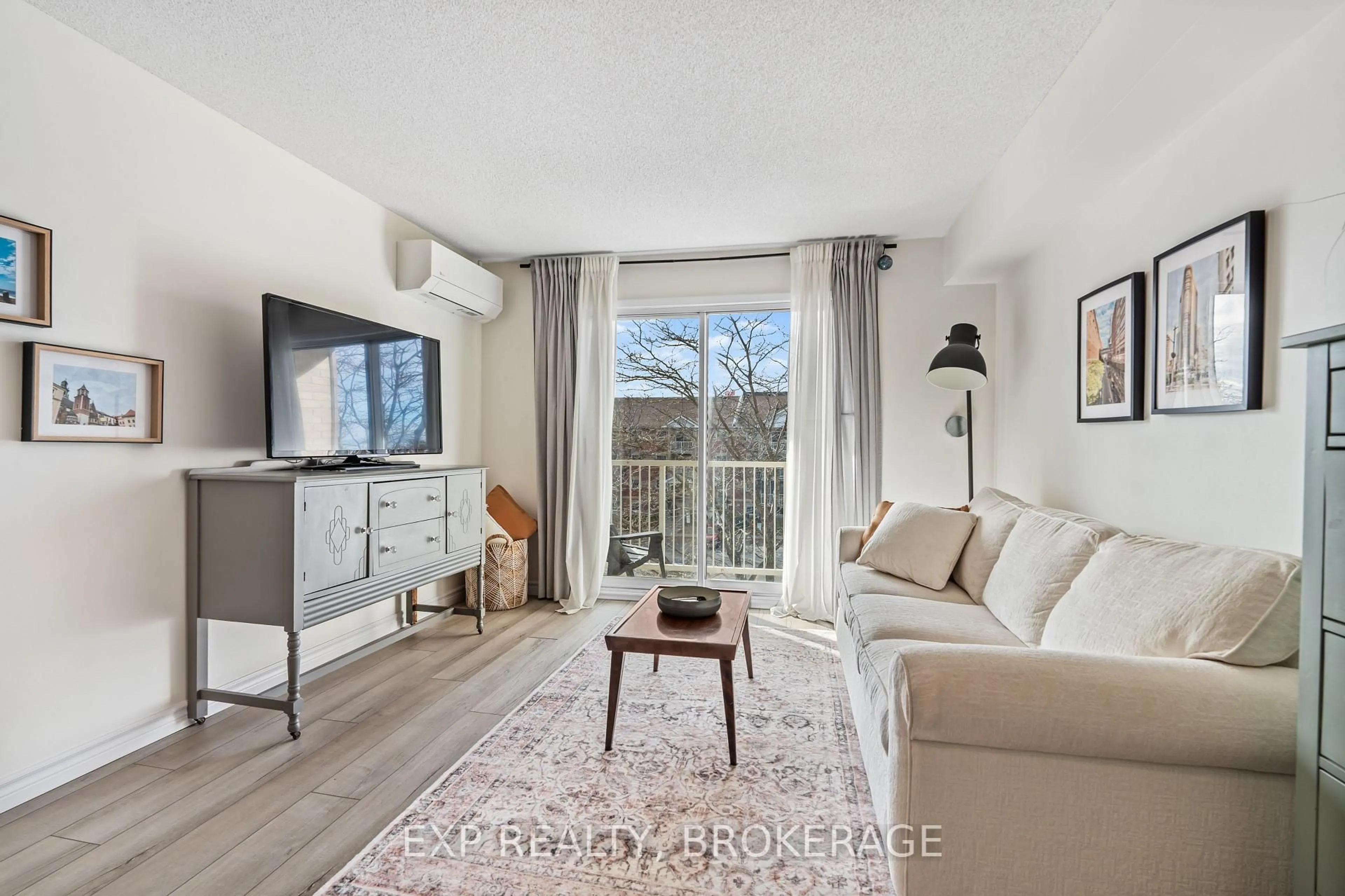 Living room with furniture, wood/laminate floor for 316 KINGSDALE Ave #408, Kingston Ontario K7M 8S2