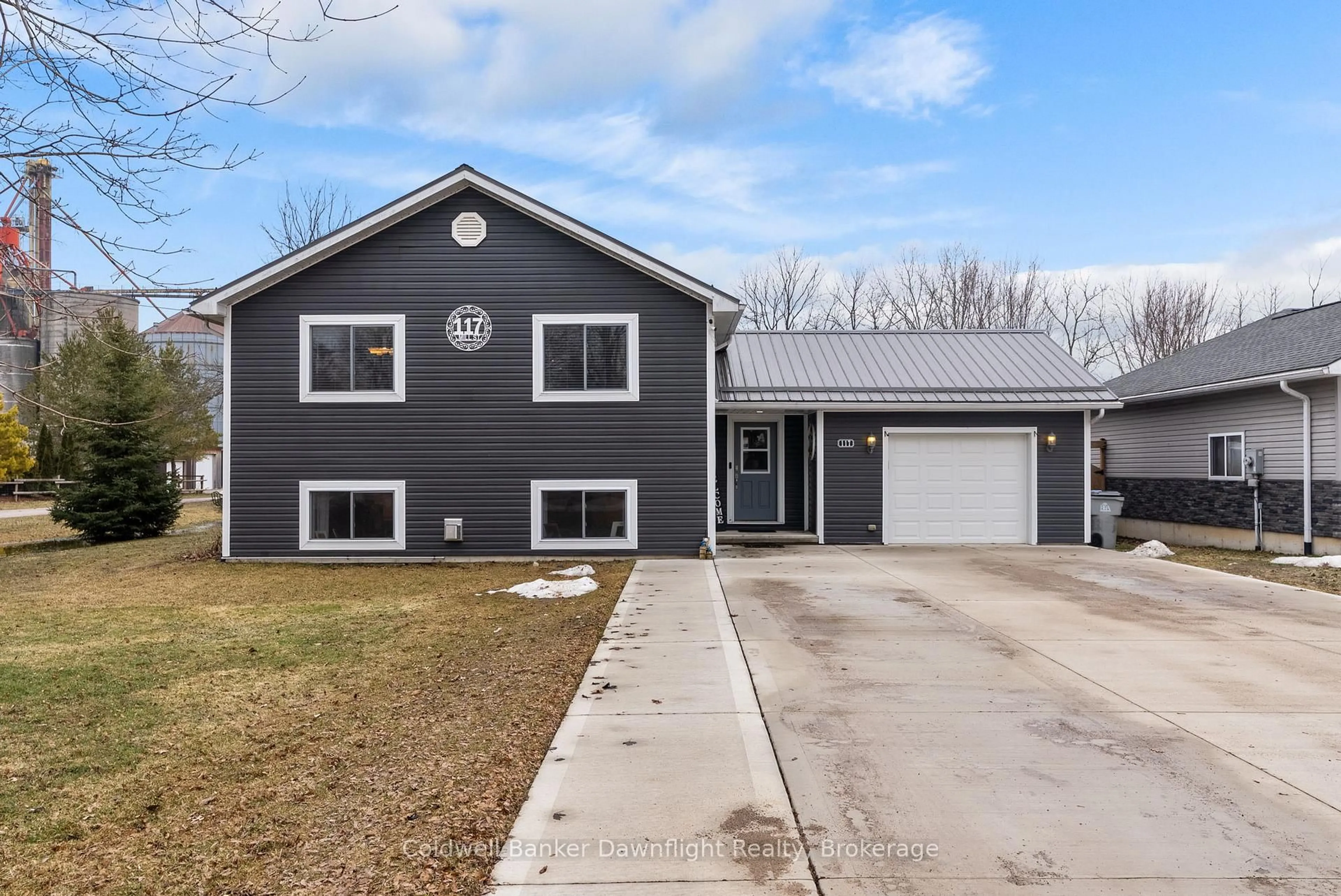 Home with vinyl exterior material, street for 117 Mill St, North Middlesex Ontario N0M 2K0