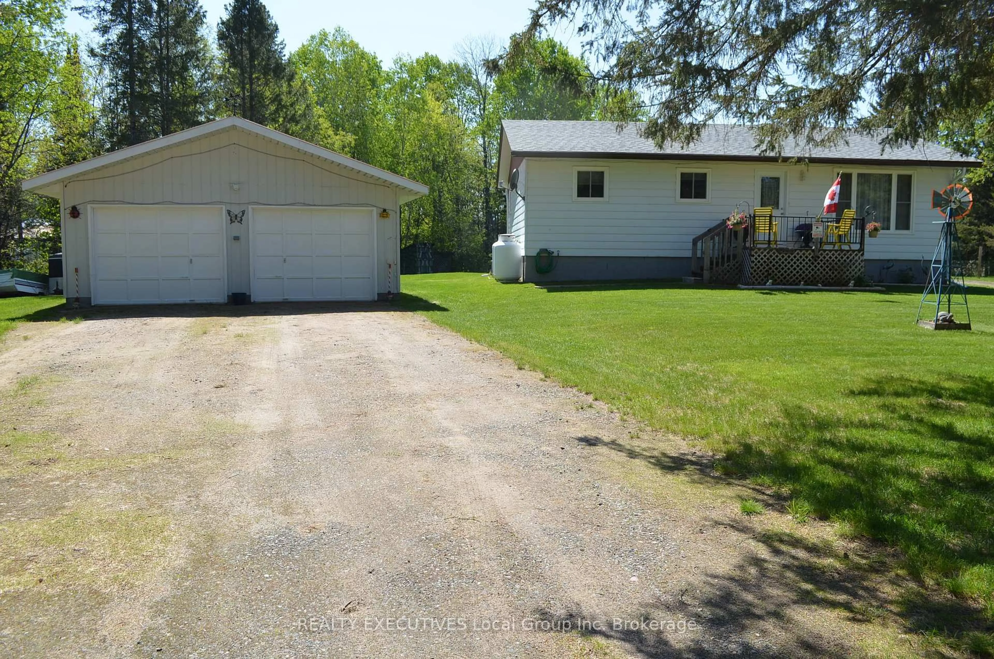 A pic from outside/outdoor area/front of a property/back of a property/a pic from drone, street for 11 CHALET Rd, Powassan Ontario P0H 2L0