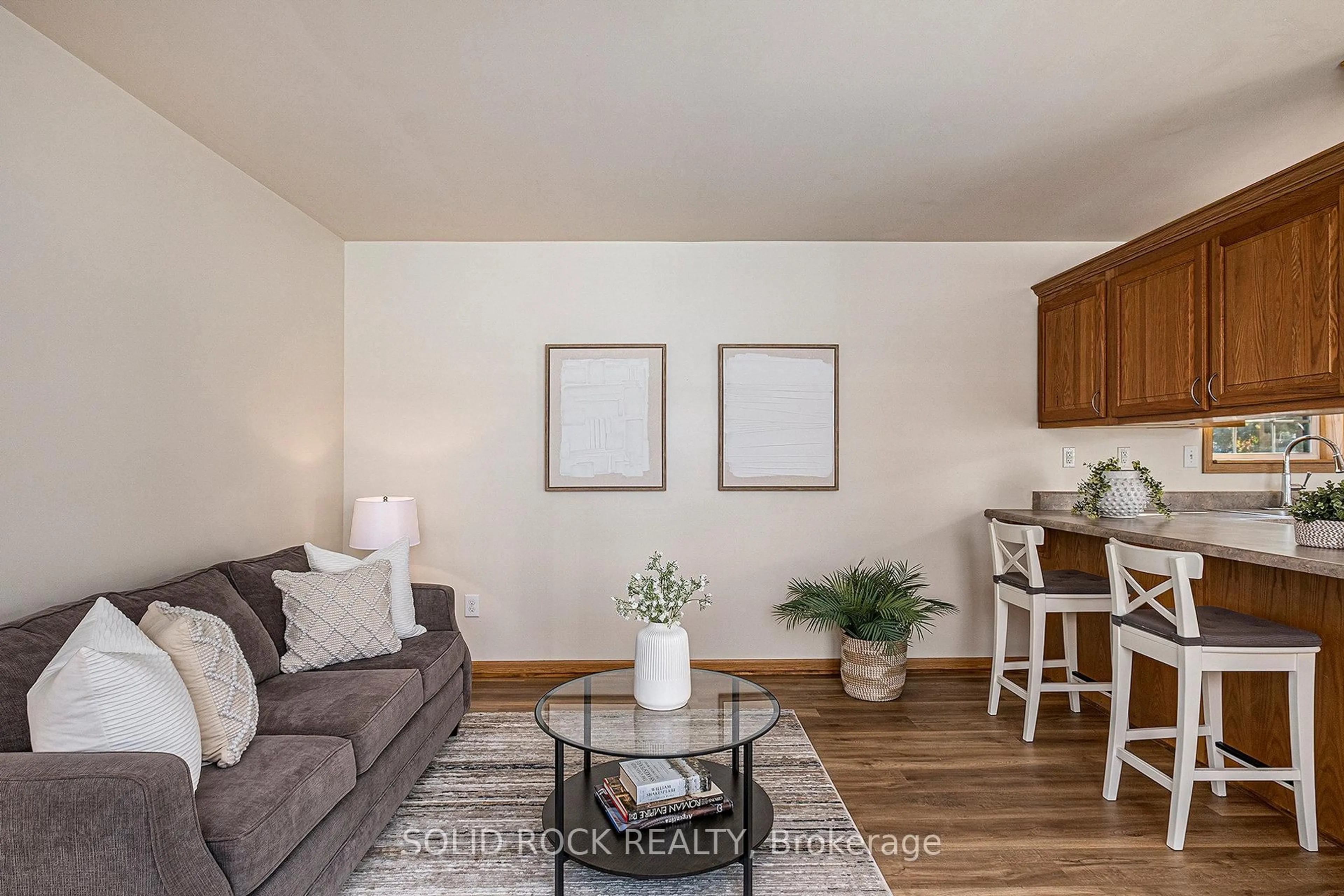 Living room with furniture, wood/laminate floor for 65 Vanier Rd, Ottawa Ontario K2H 7P6
