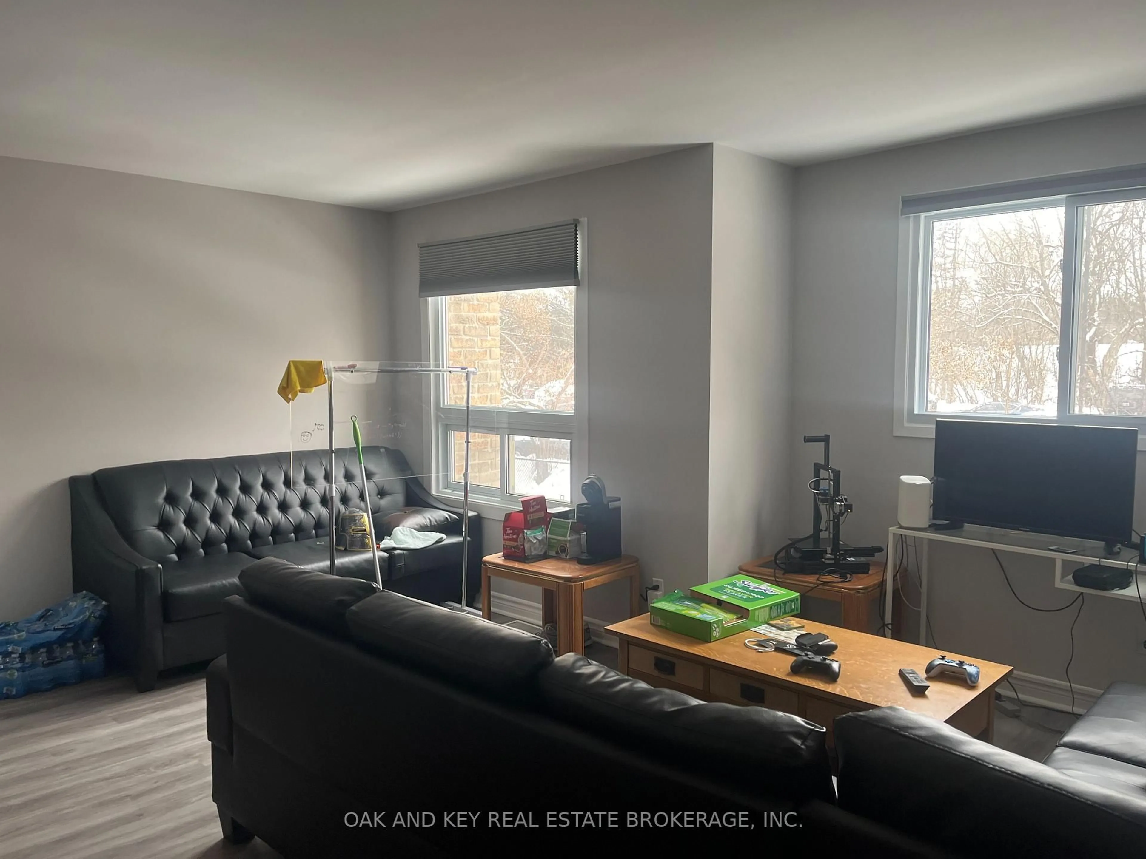 Living room with furniture, wood/laminate floor for 40 Summit Ave #52, London North Ontario N6H 4S3