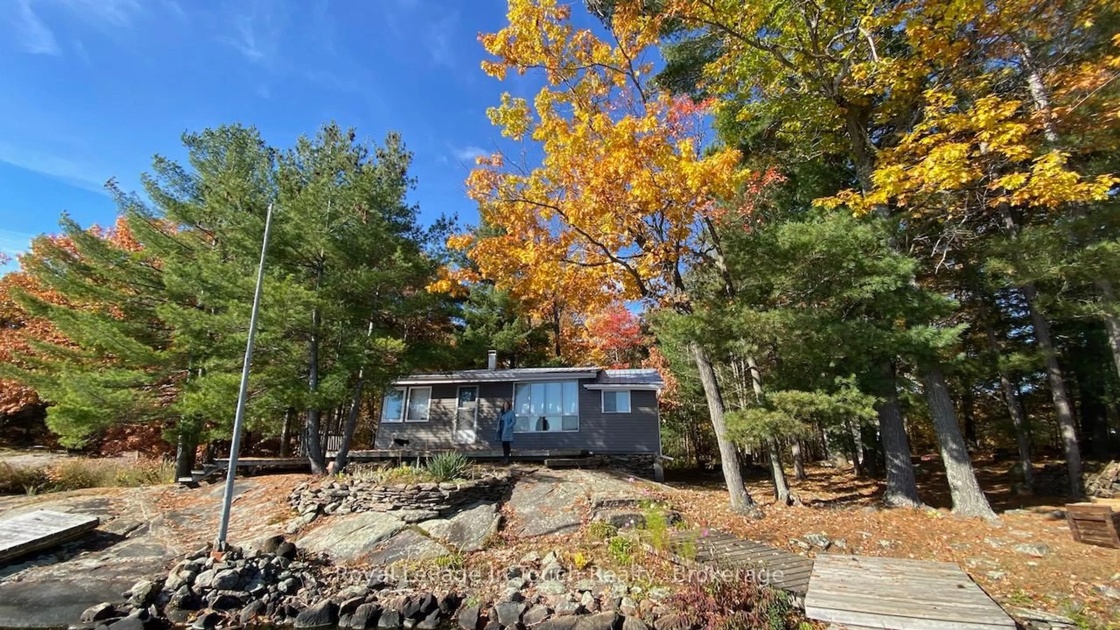 A pic from outside/outdoor area/front of a property/back of a property/a pic from drone, water/lake/river/ocean view for 1916 Six Mile lake Shore Island, Georgian Bay Ontario L0K 1S0