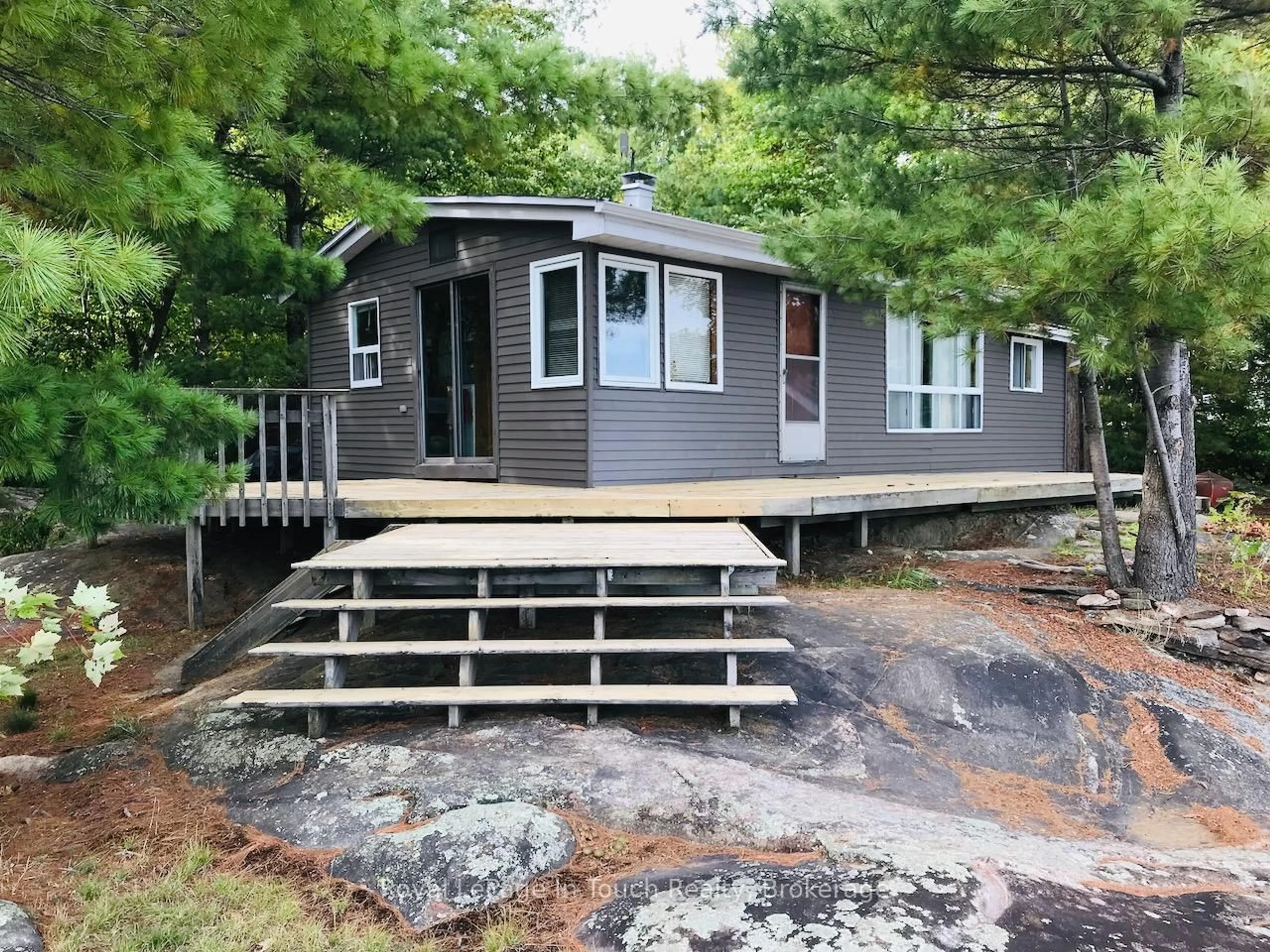 Home with vinyl exterior material, water/lake/river/ocean view for 1916 Six Mile lake Shore Island, Georgian Bay Ontario L0K 1S0
