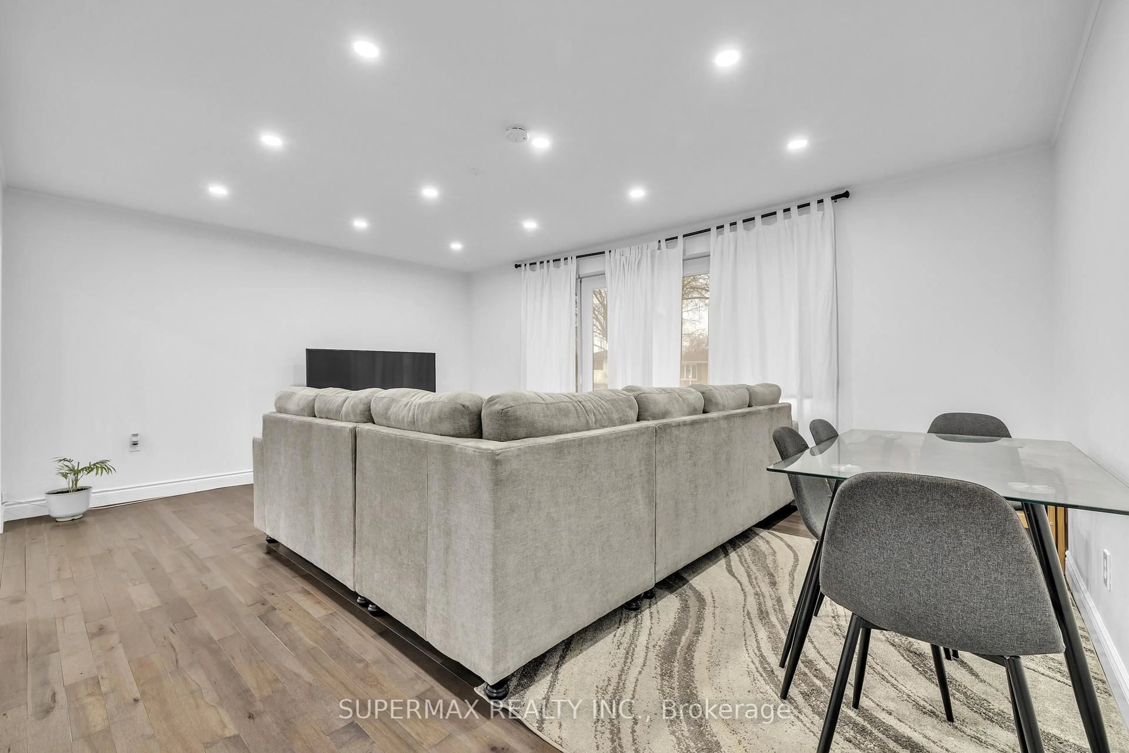 Living room with furniture, wood/laminate floor for 1058 Apache Rd, London East Ontario N5V 2W3