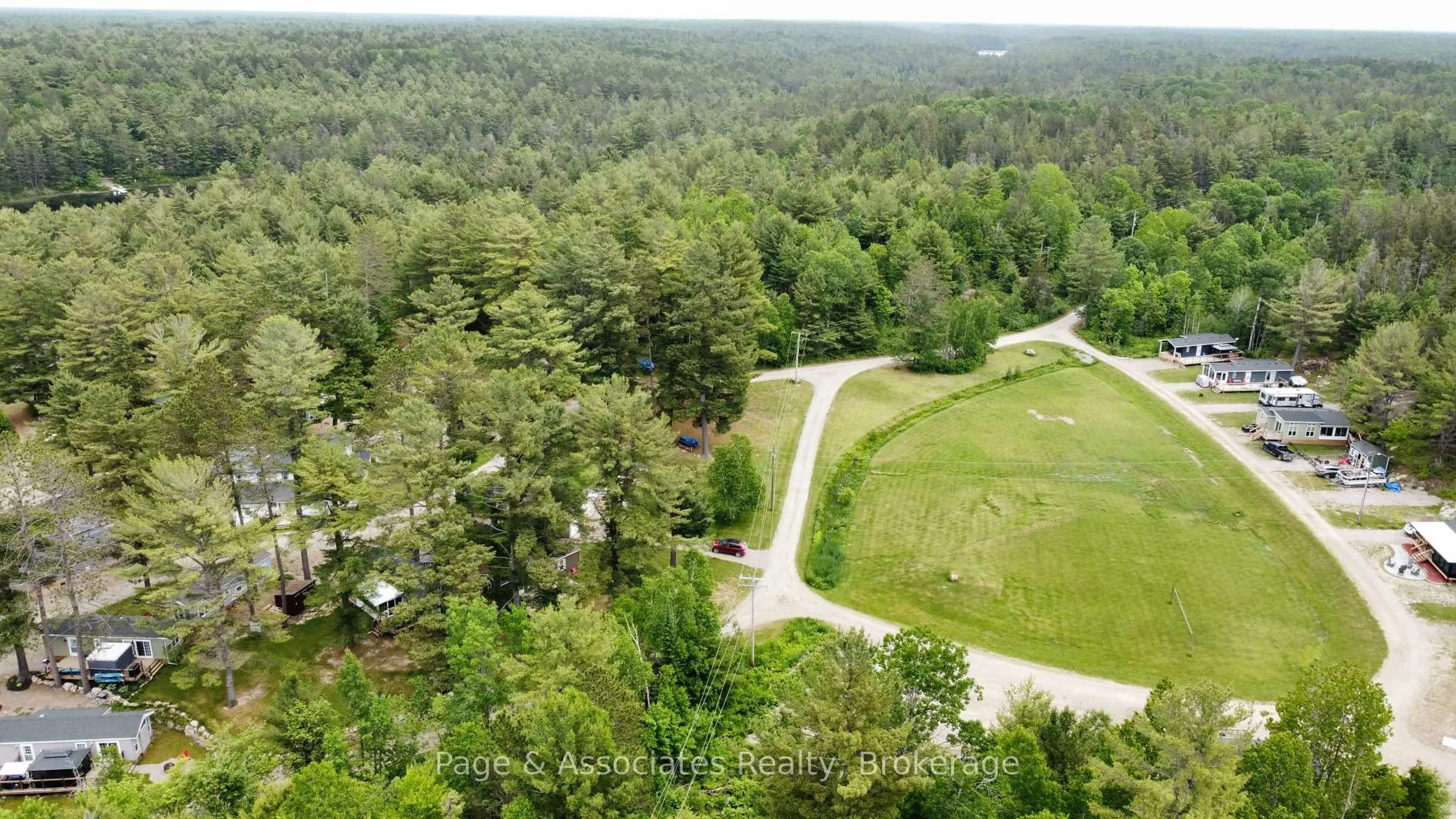 A pic from outside/outdoor area/front of a property/back of a property/a pic from drone, forest/trees view for 120 Happy Landing Rd, French River Ontario P0M 2N0
