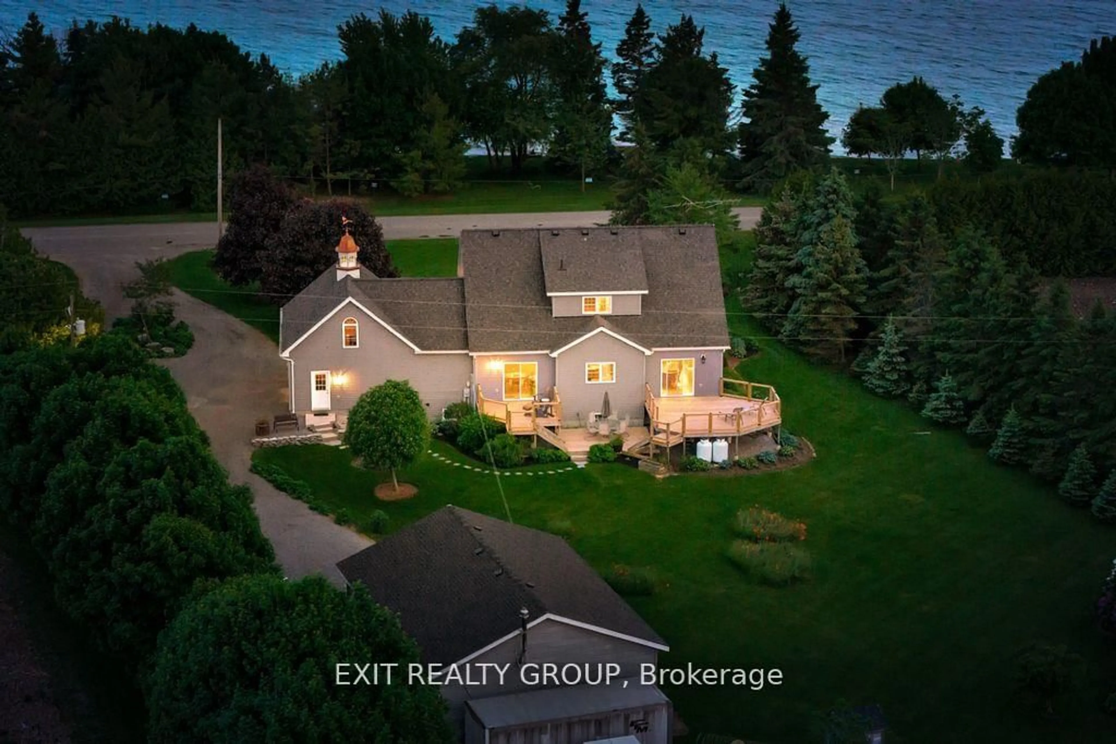 A pic from outside/outdoor area/front of a property/back of a property/a pic from drone, water/lake/river/ocean view for 830 County Rd 20, Prince Edward County Ontario K0K 3L0